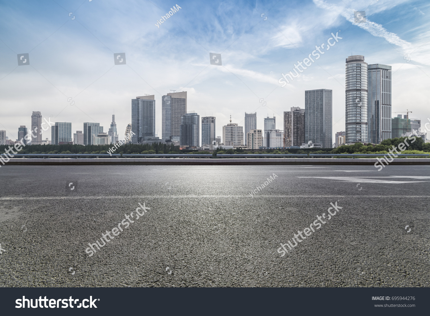 Panoramic skyline and buildings with empty road
 #695944276