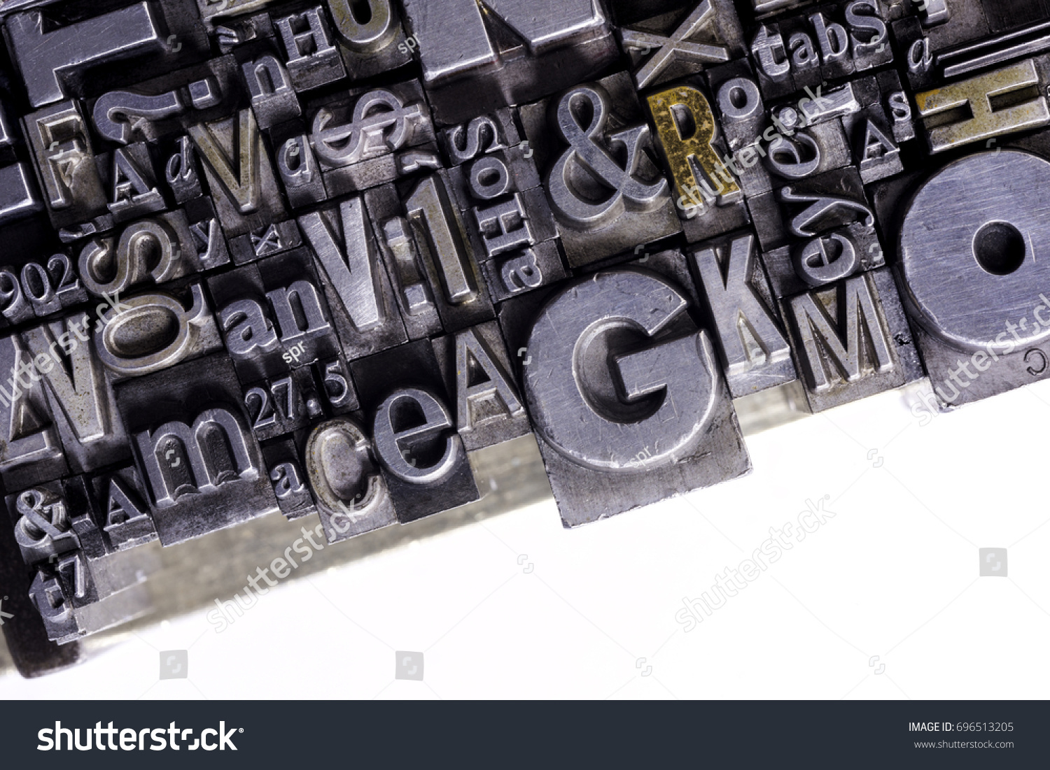 Historical letterpress types, also called as lead letters. 
These kind of letters were used in Gutenberg presses. 
These letters were the beginning of typography. And were used in typesetting #696513205