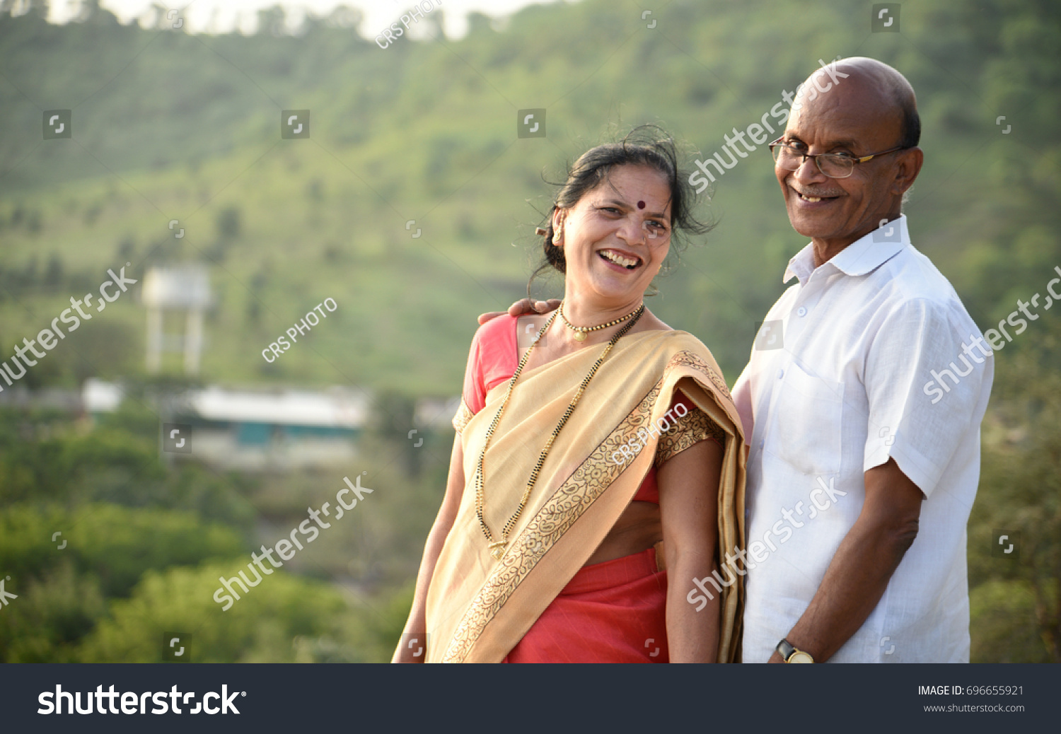 portrait of happy senior couple husband and wife wearing Indian clothing. #696655921