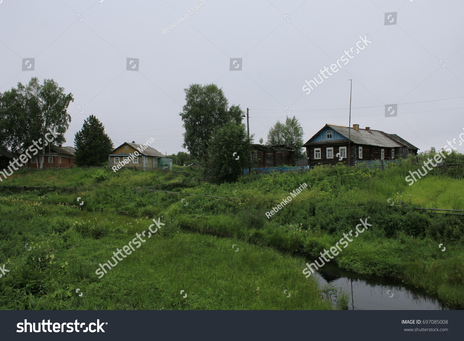 View of the river and old Pomor houses #697085008