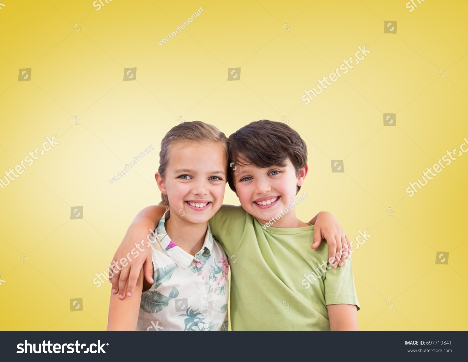 Digital composite of Boy and girl hugging in front of yellow background #697719841
