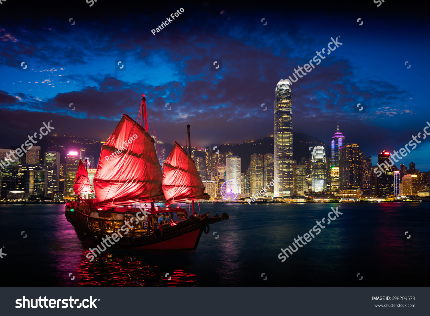 Victoria Harbour Hong Kong night view with junk ship on foreground #698209573