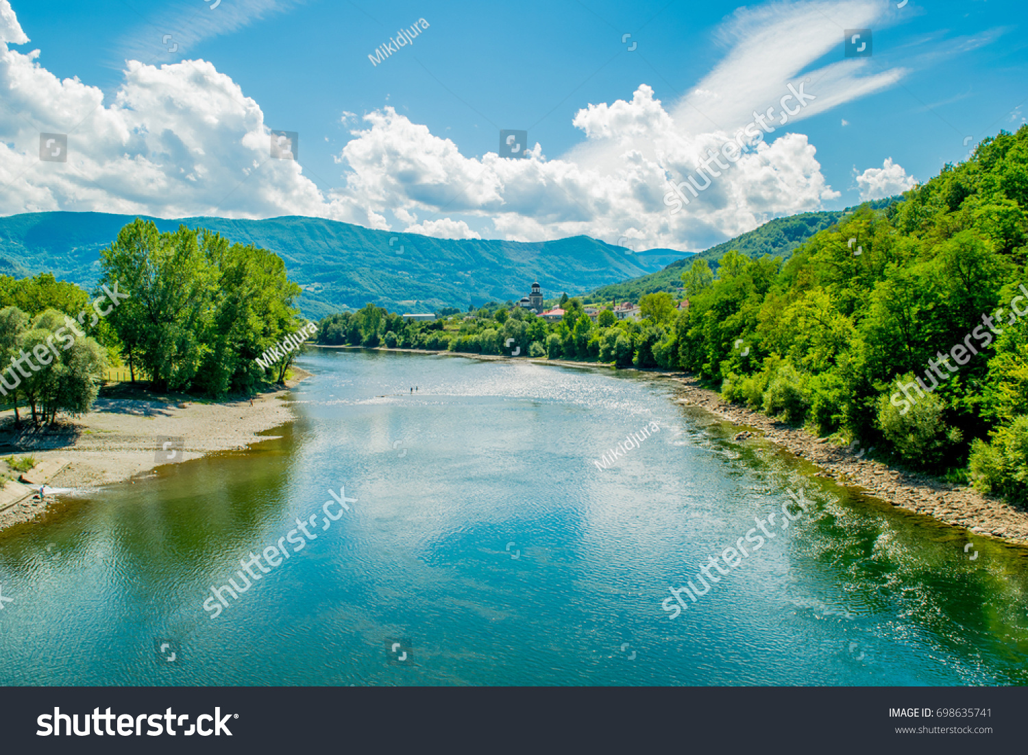 Majestic look to the River in eastern Serbia. Beautiful landscape include sky, clouds, mountains, river, forest, stone coast and reflection.  #698635741
