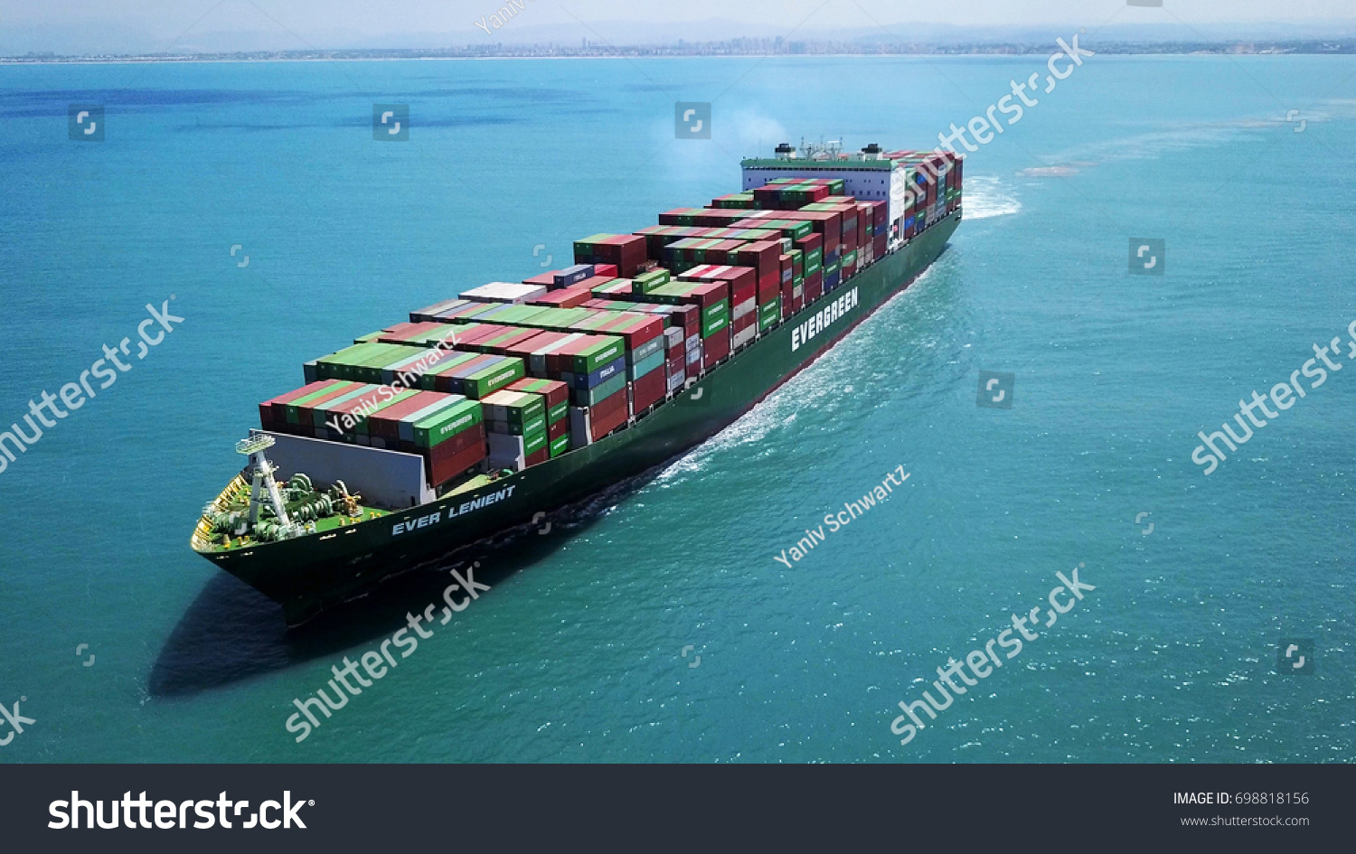 Haifa, Israel - 18 Aug, 2017: a huge big large container ship sails on open water fully loaded with containers and cargo - aerial  view #698818156