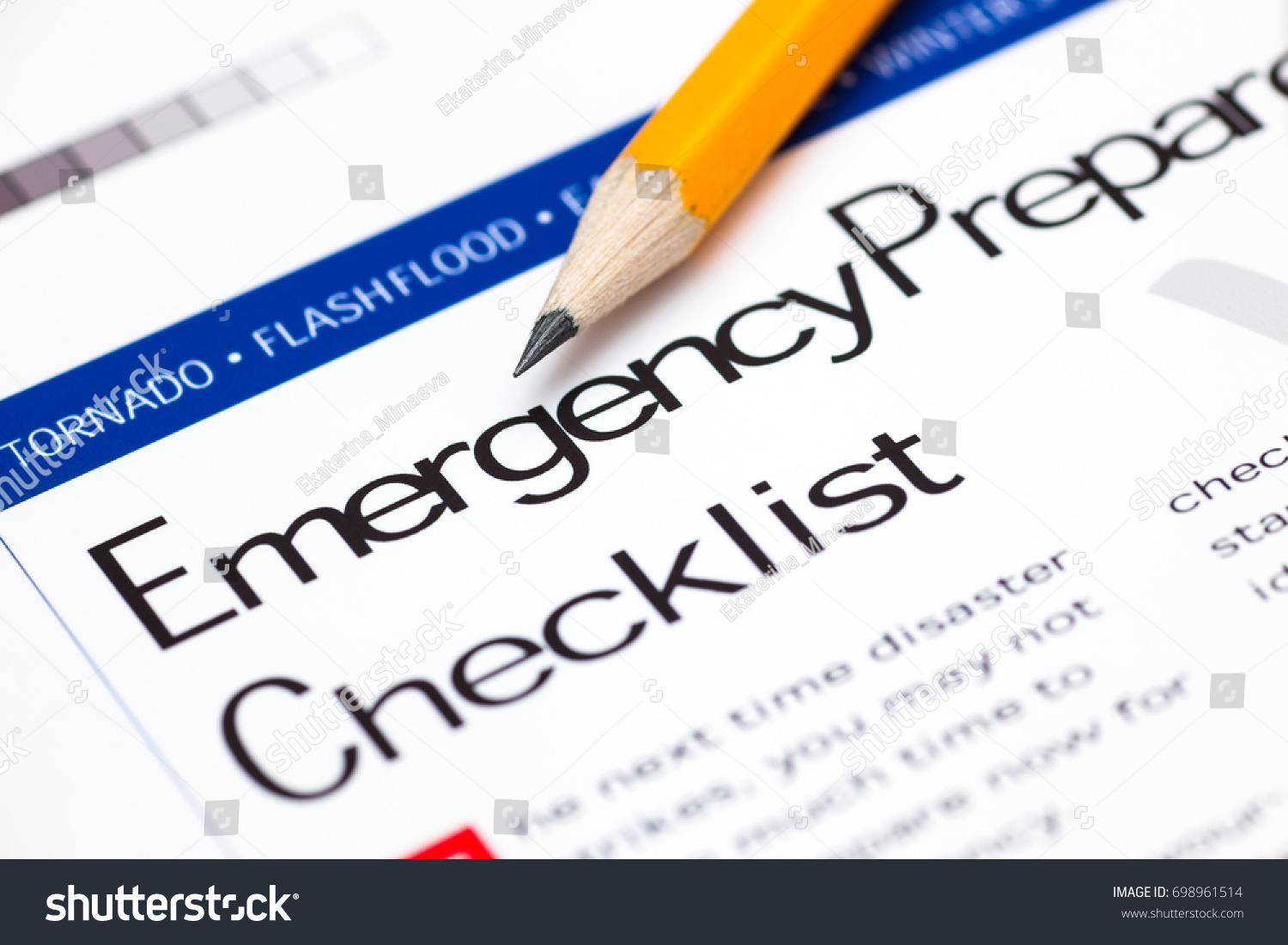 Emergency Preparedness Checklist with pencil. Close-up. #698961514