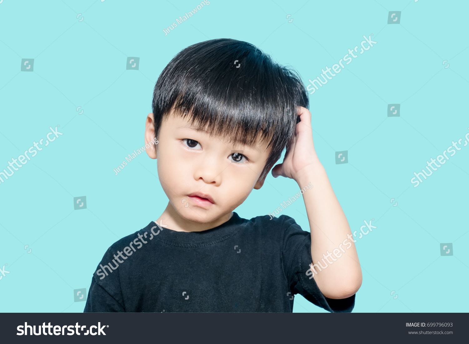 Young asian boy get confused and scratching his head, confusing concept #699796093