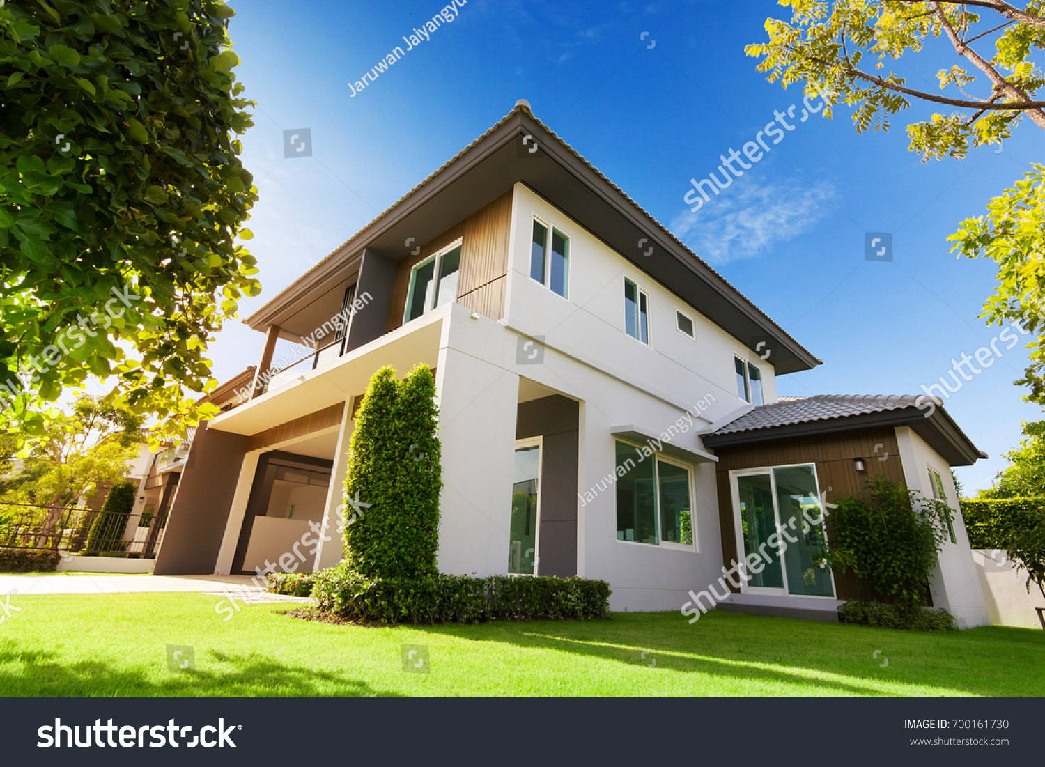 Exterior view of house with green grass.Home For Sale,Rent,Housing and Real Estate concept. #700161730