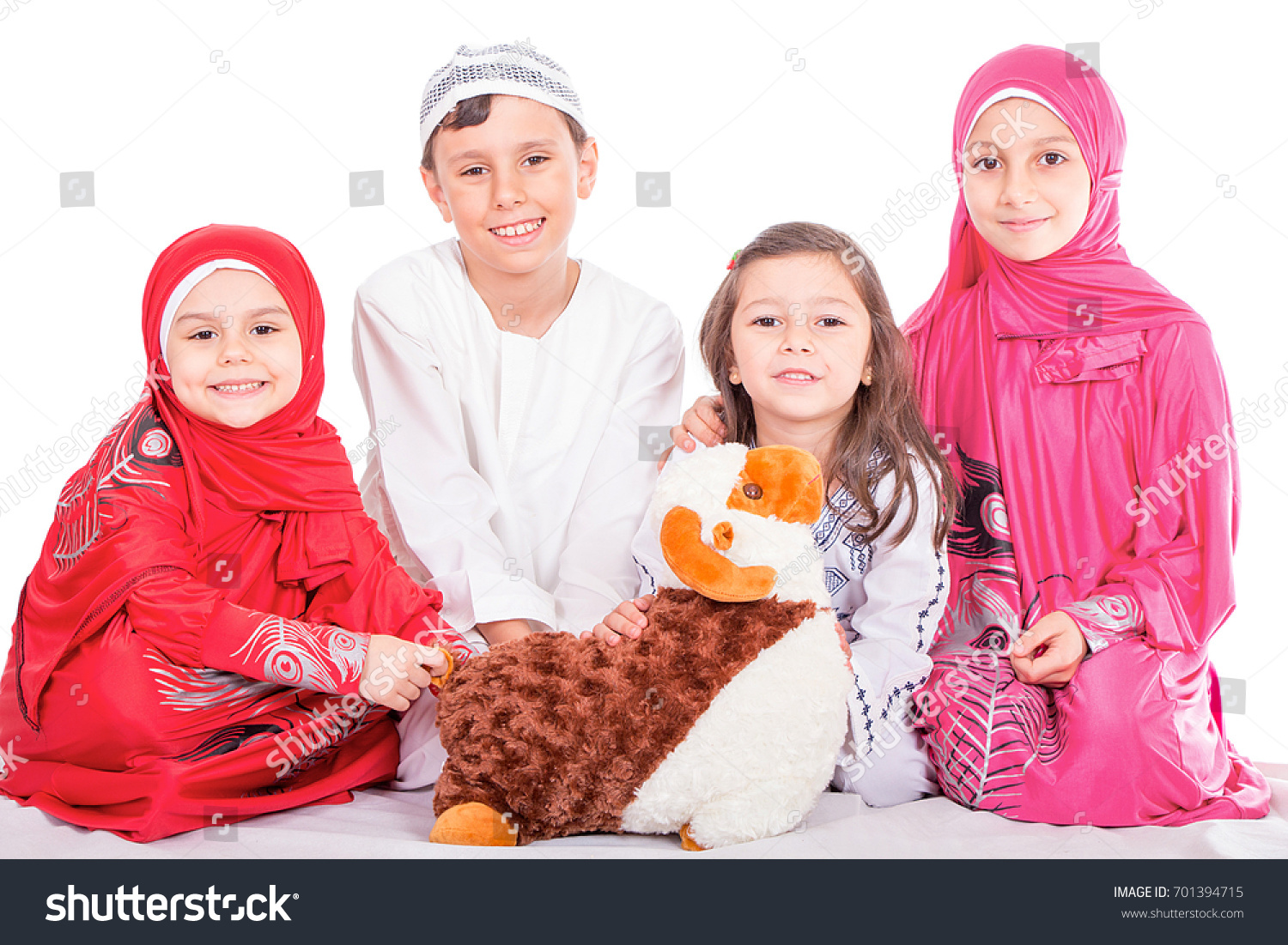 Happy little Muslim kids playing with sheep toy - celebrating Eid ul Adha - Happy Sacrifice Feast #701394715