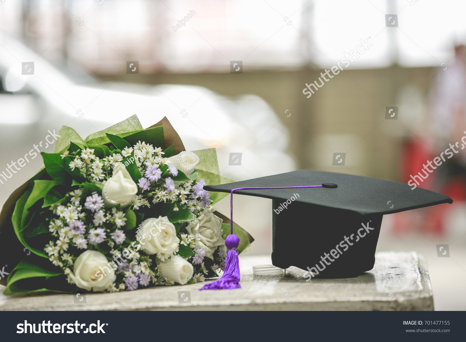 Graduation cap and beautiful flower #701477155
