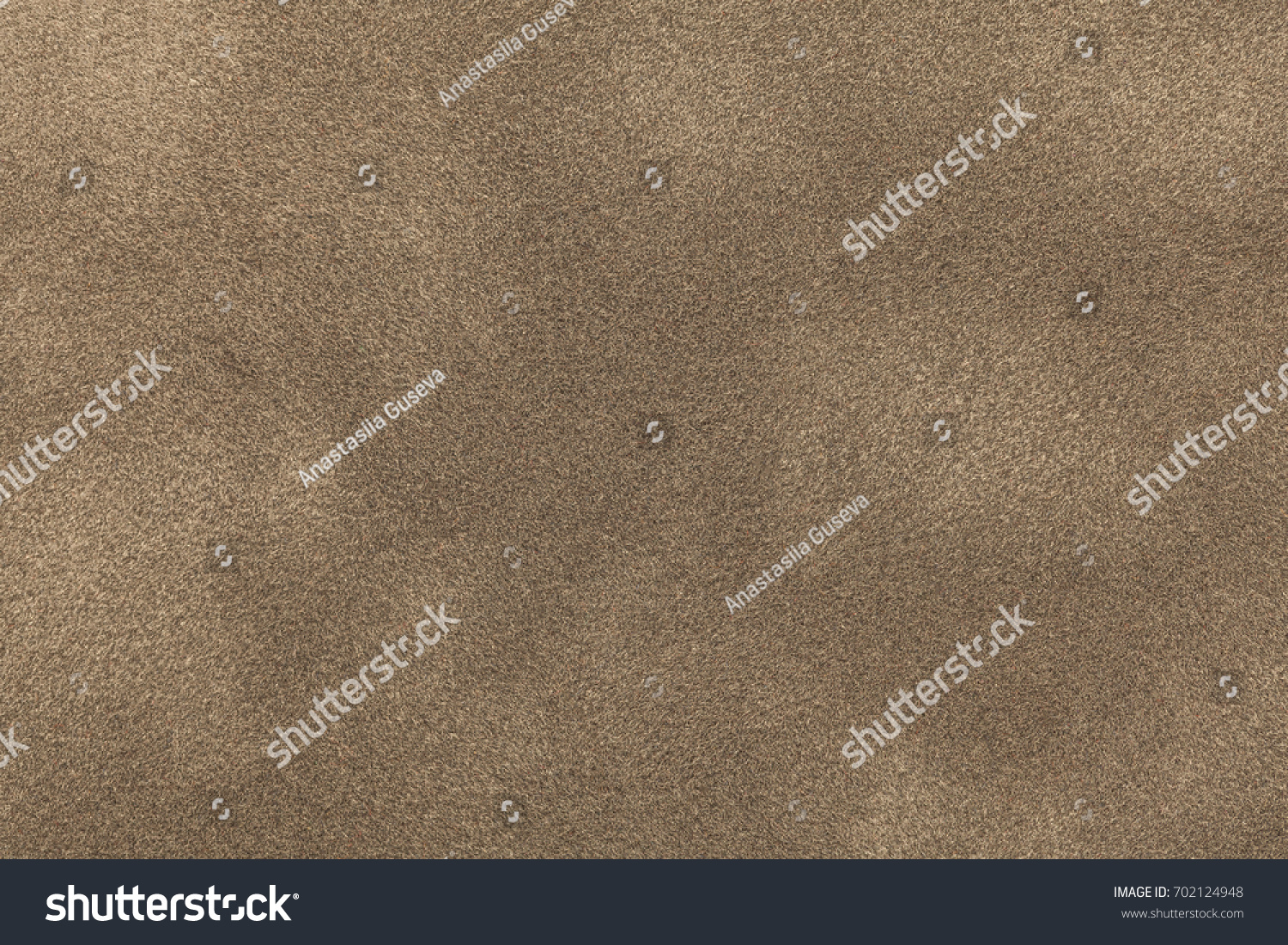 Background of light bronze suede fabric closeup. Velvet matt texture of sand nubuck textile. #702124948