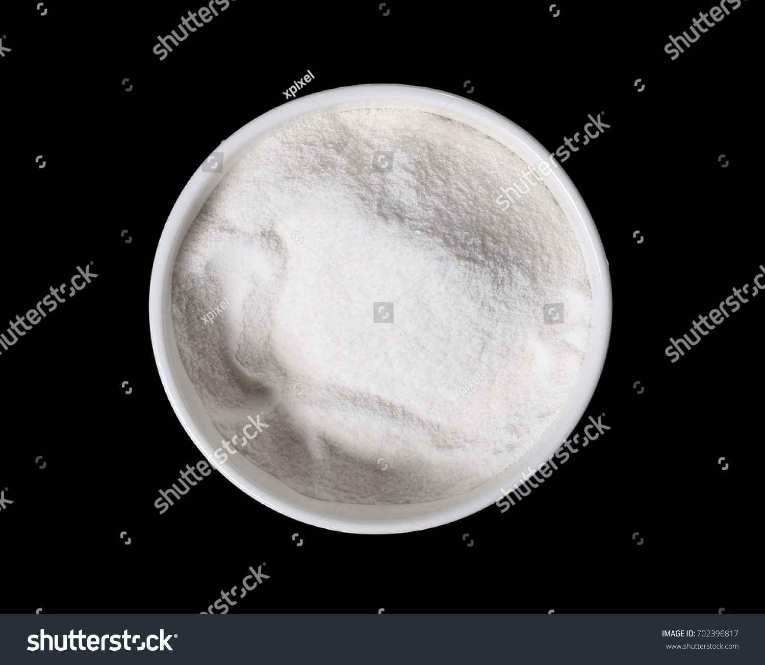 Pile rice flour in bowl isolated on black background #702396817
