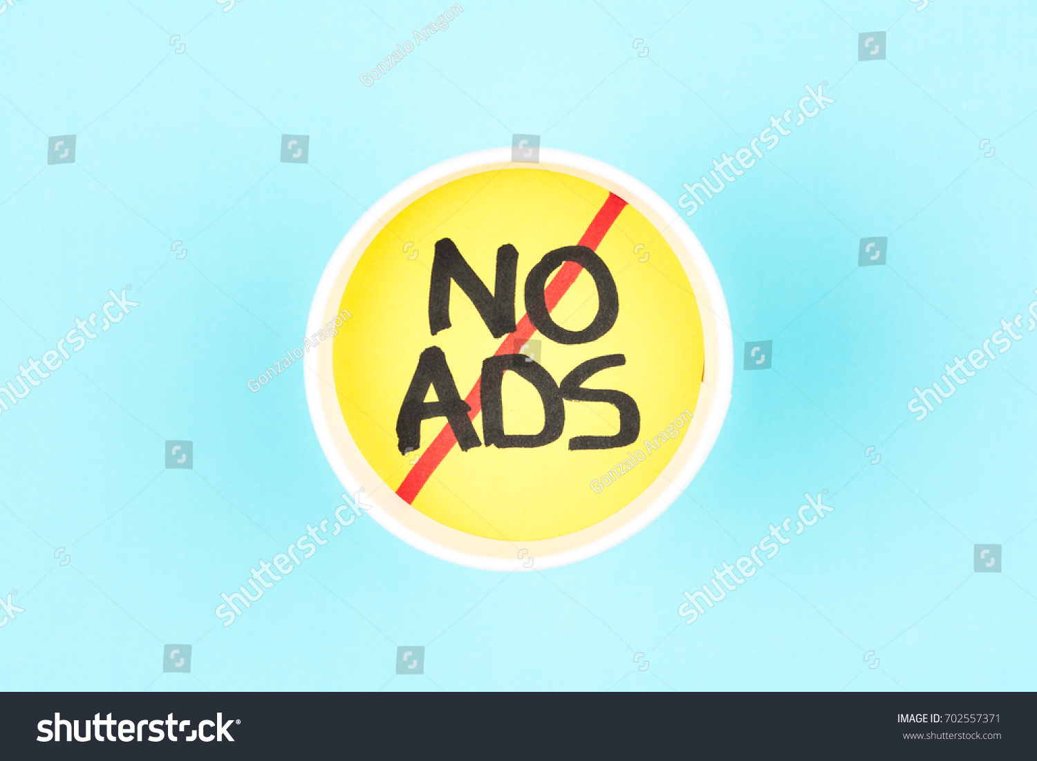 
Ad free concept. No ads symbol. Ads free sign with a cup paper on blue background. #702557371