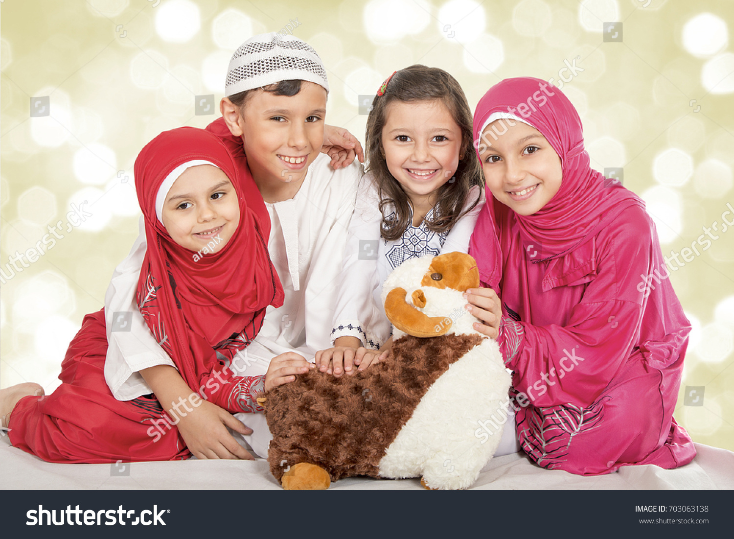 Happy little Muslim kids playing with sheep toy - Family celebrating Eid ul Adha - Happy Sacrifice Feast #703063138