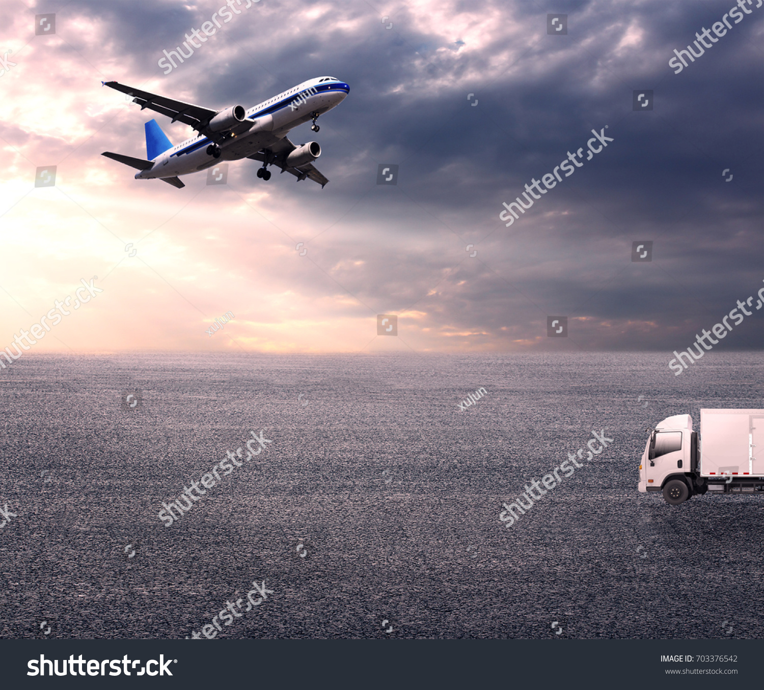 Wide skies and wide asphalt roads, and large planes and vans #703376542