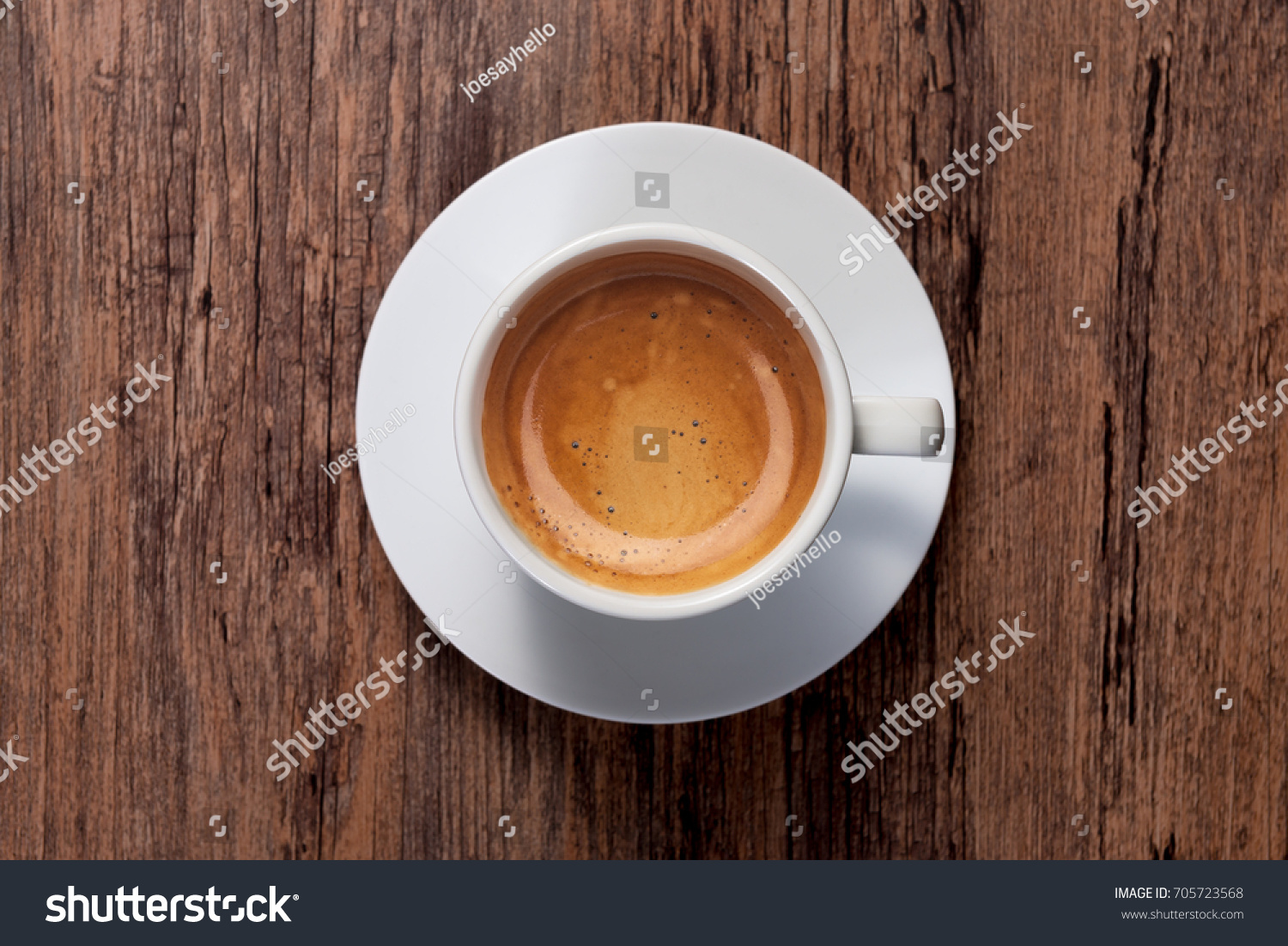top view a cup of espresso coffee on wooden table background #705723568