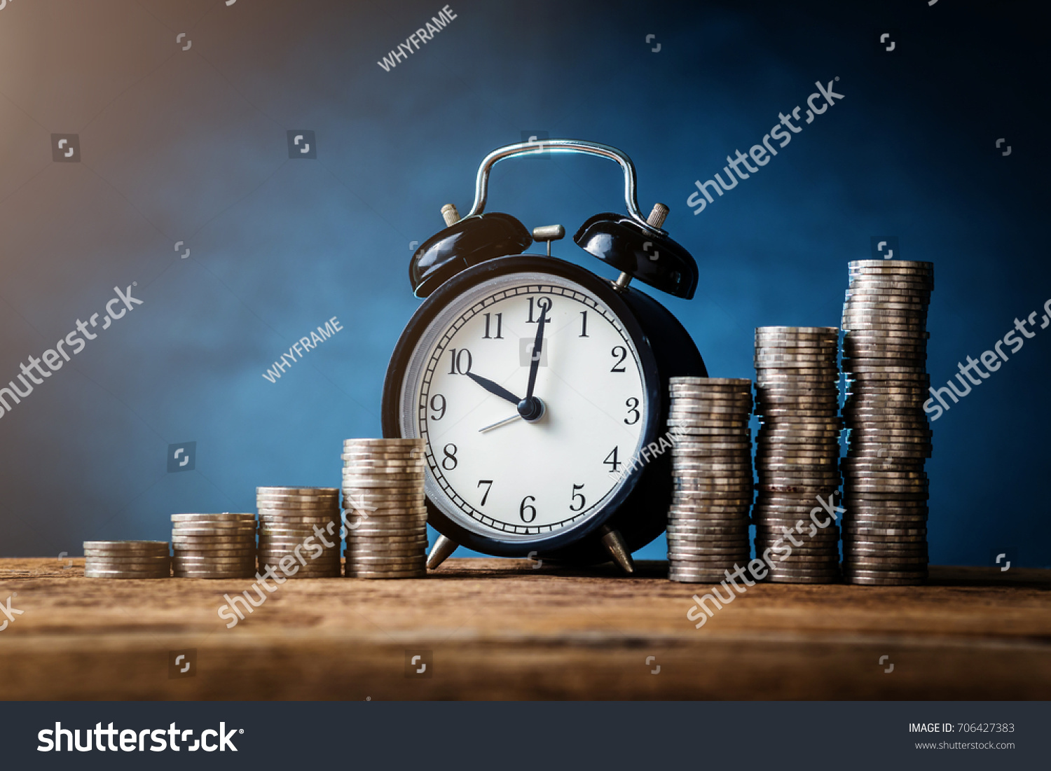 business financial ideas concept with coins stack and alarmclock isolate background with free copyspace for your creativity ideas text #706427383