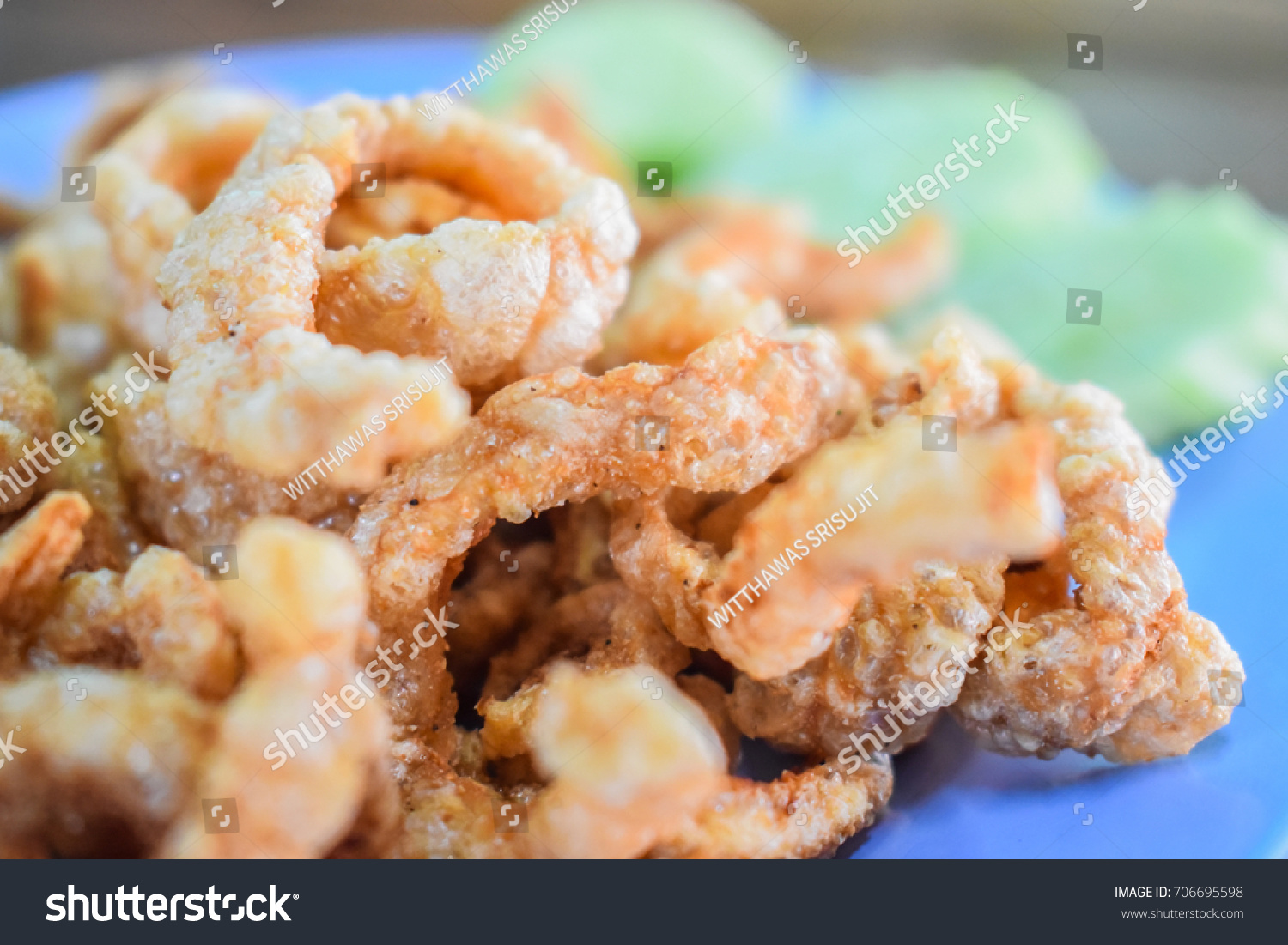 pork crackling, It can also be fried or roasted in pork fat as a snack. The frying renders much of the fat that is attached to the uncooked rind. #706695598