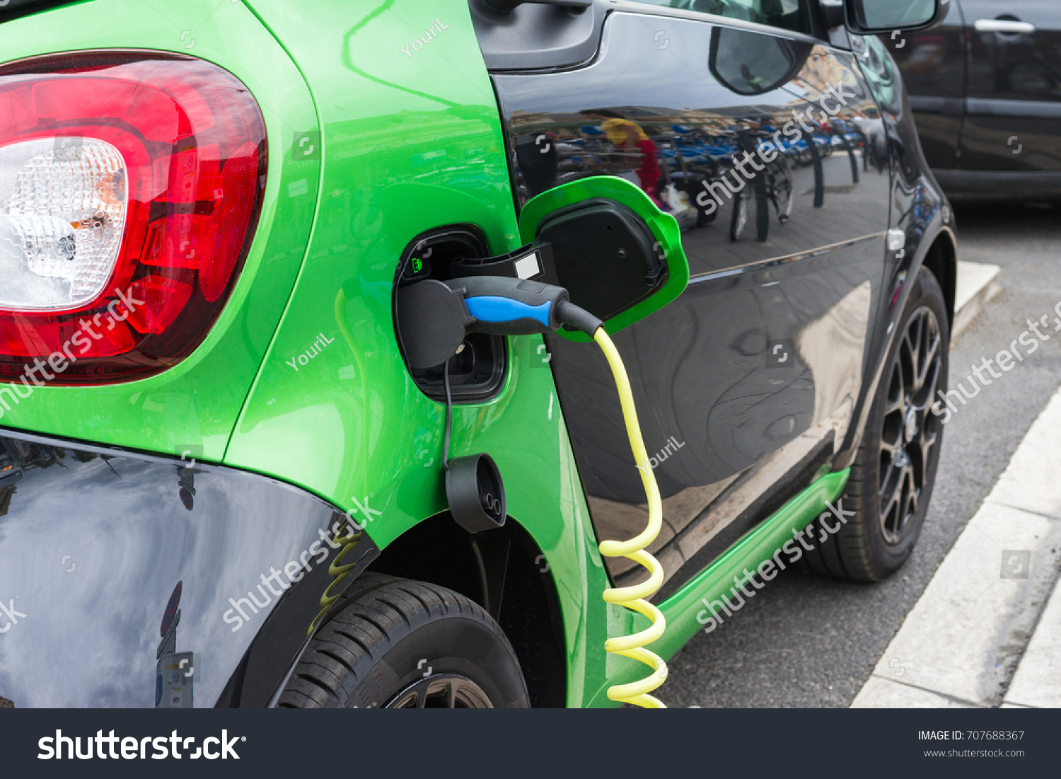 Close up of electric car being charging #707688367