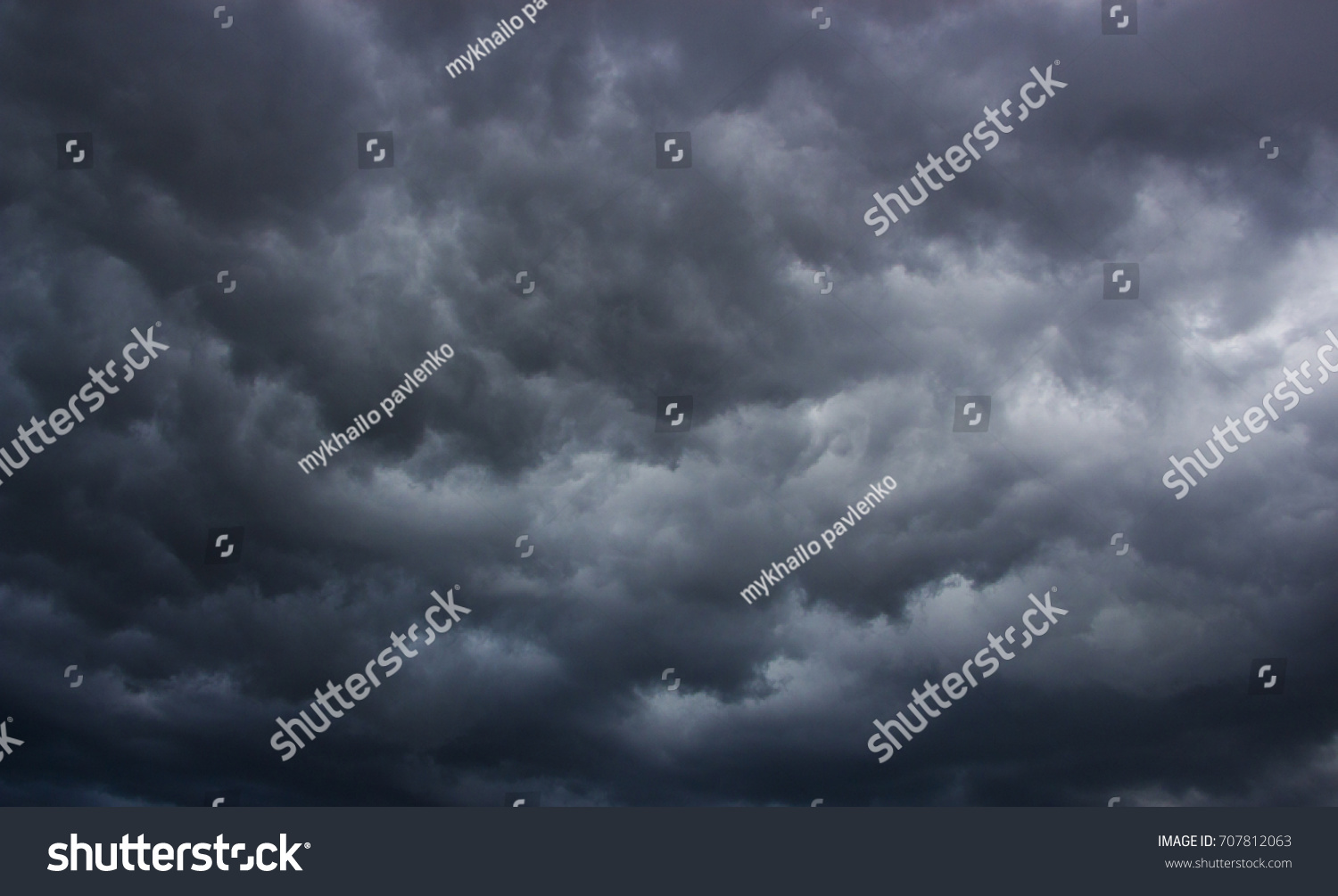 Light in the Dark and Dramatic Storm Clouds background #707812063