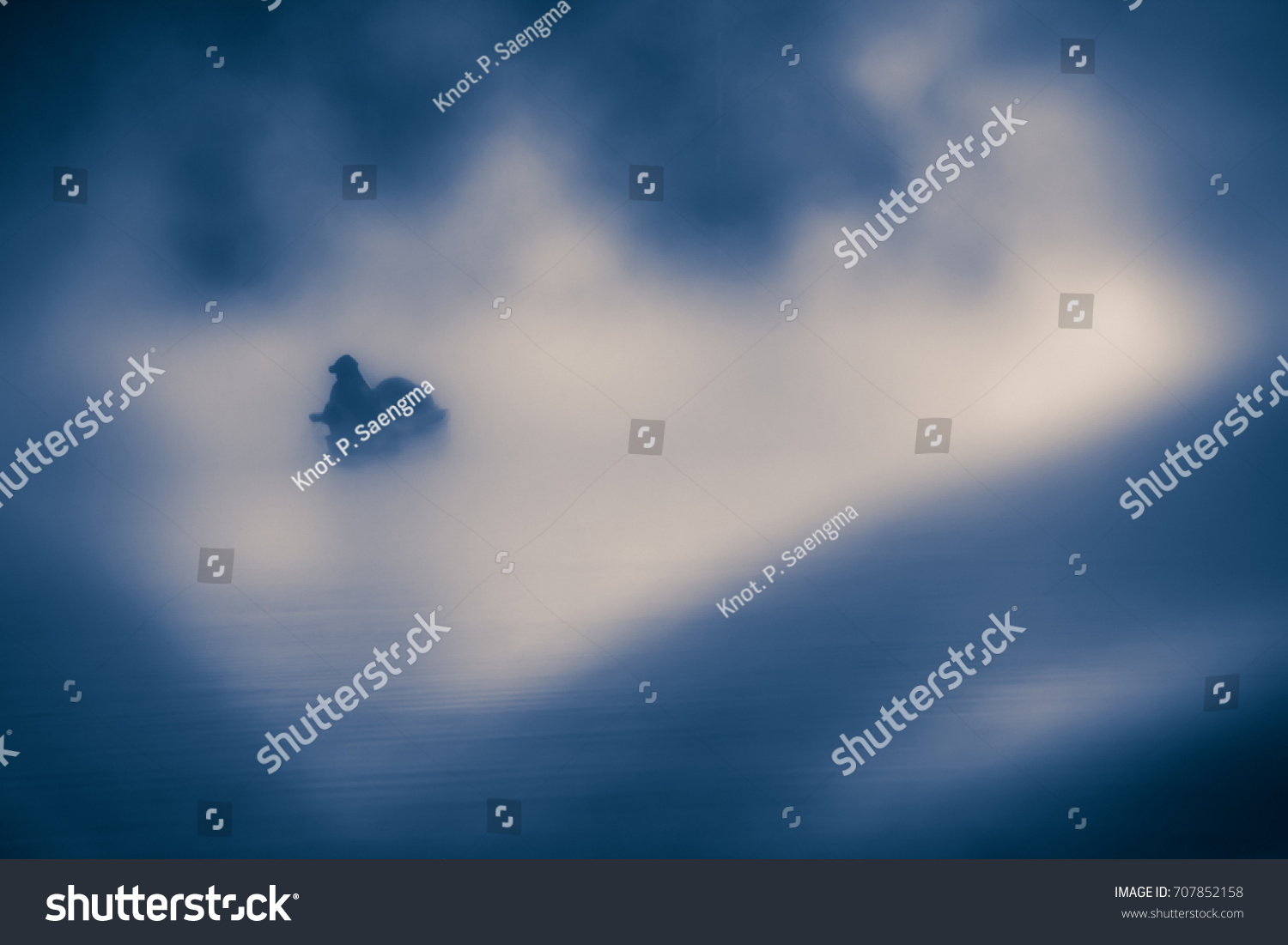 soft focus blurred feeling blue lonely emotion abstract conceptual, person on boat with white mist, low key grungy style image  #707852158