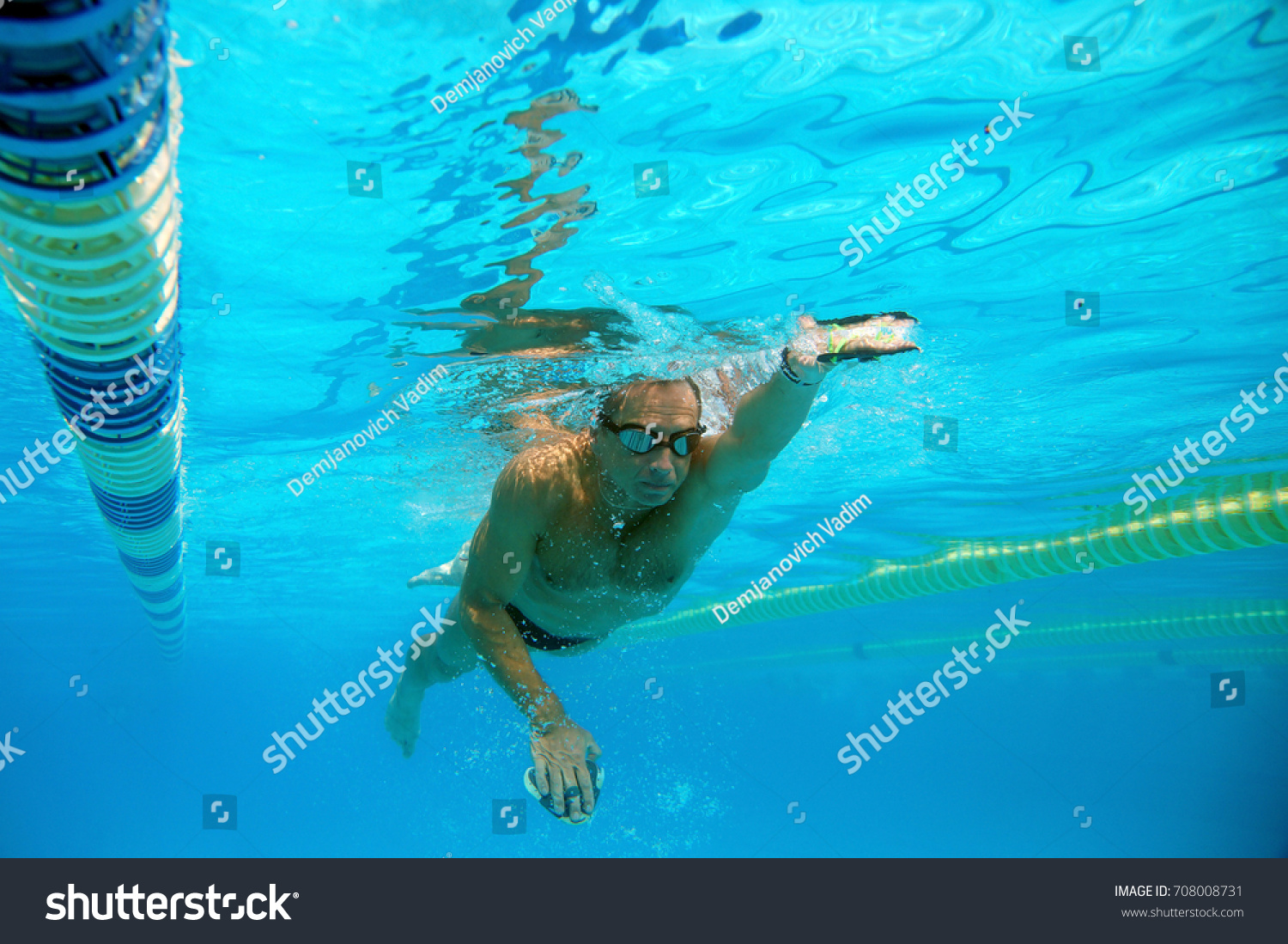 Swimmer in the big outdoor swimming pool #708008731