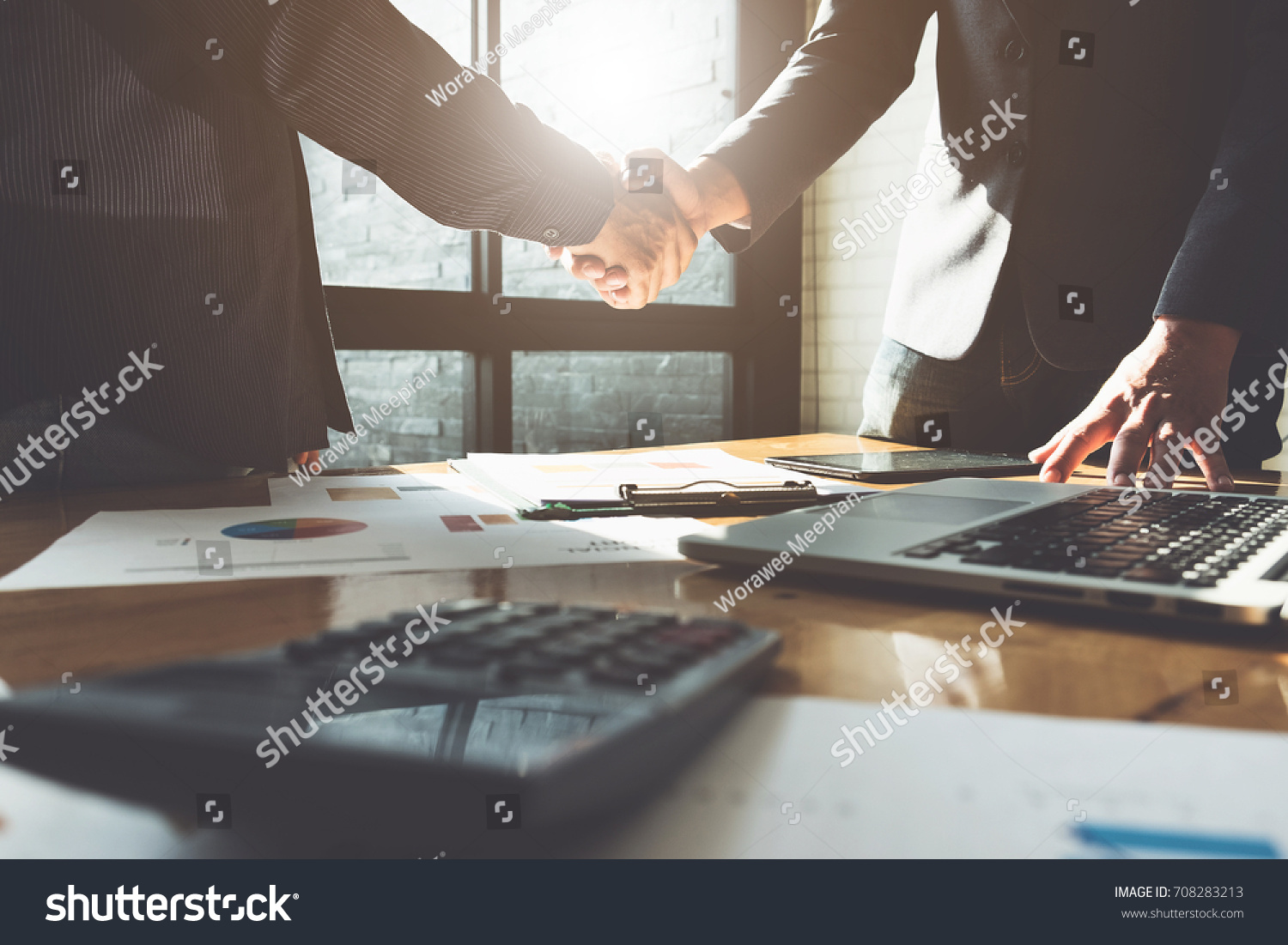 Business partnership meeting concept. Image businessmans handshake. Successful businessmen handshaking after good deal. Group support concept. #708283213
