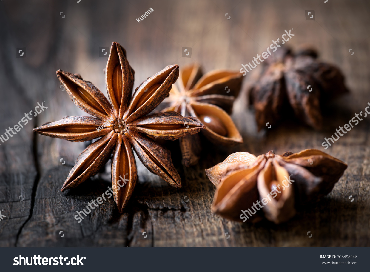 Anise stars closeup against dark rustic wooden background #708498946