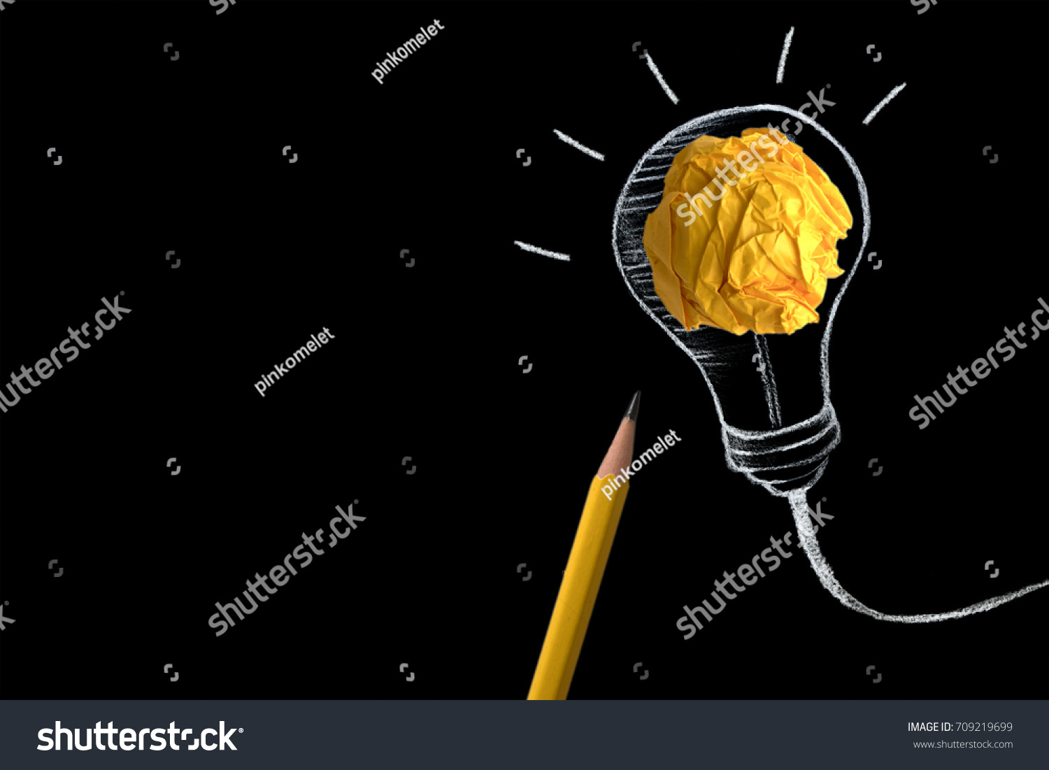 yellow pencil with yellow crumpled paper ball and hand drawn a light bulb , creative innovation idea symbol concept #709219699