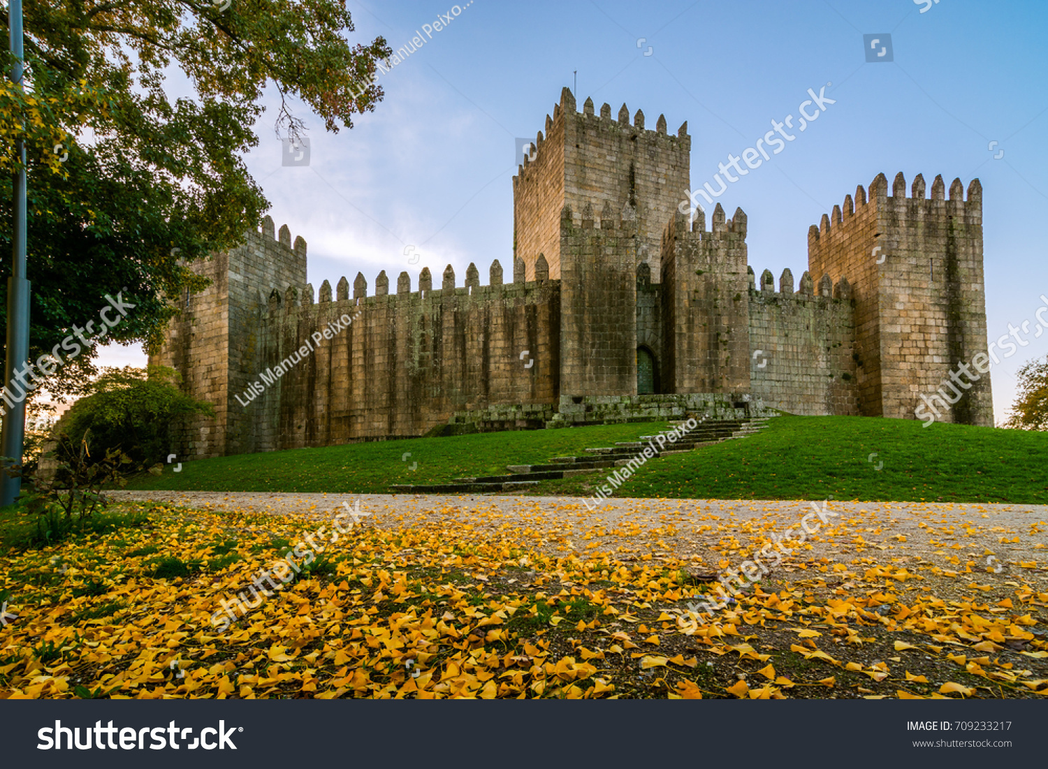 Guimaraes, Portugal - November 23 , 2014 : End of a sunny day in the autumn next to the castle of Guimaraes #709233217