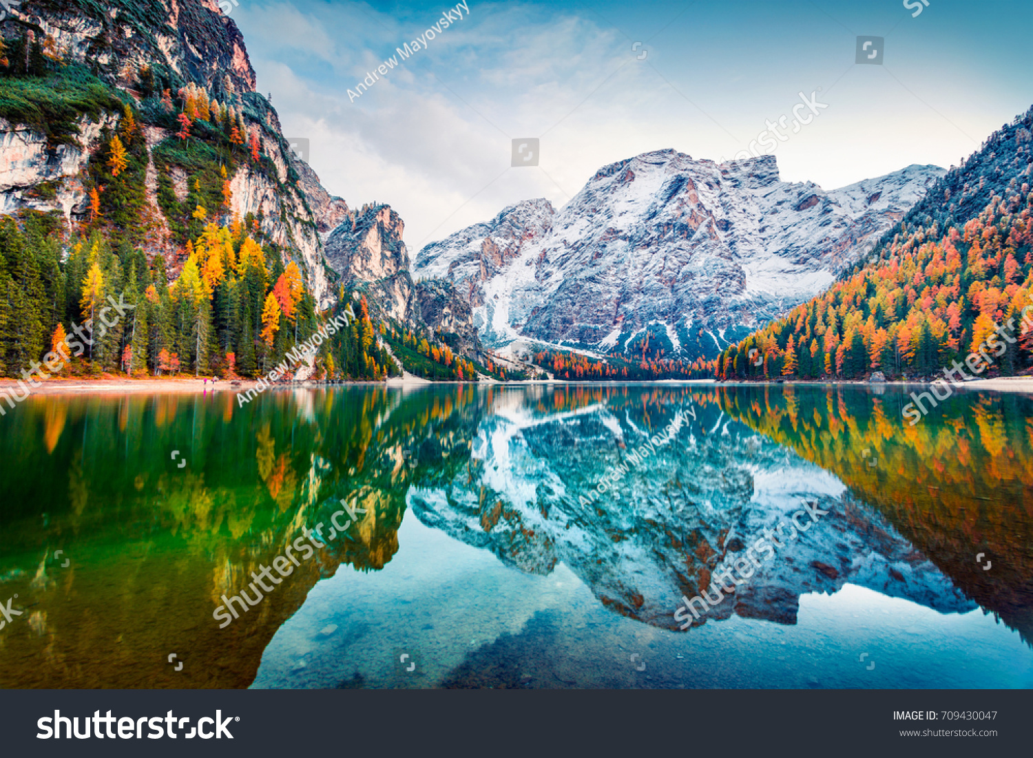 First snow on Braies Lake. Colorful autumn landscape in Italian Alps, Naturpark Fanes-Sennes-Prags, Dolomite, Italy, Europe. Beauty of nature concept background.  #709430047