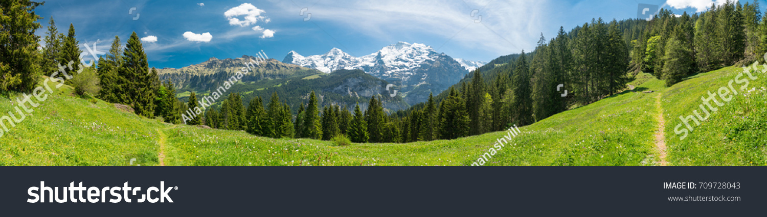 Spectacular mountain views and hiking trail in the Swiss Alps landscape near Stechelberg the district of Lauterbrunnen, Switzerland #709728043