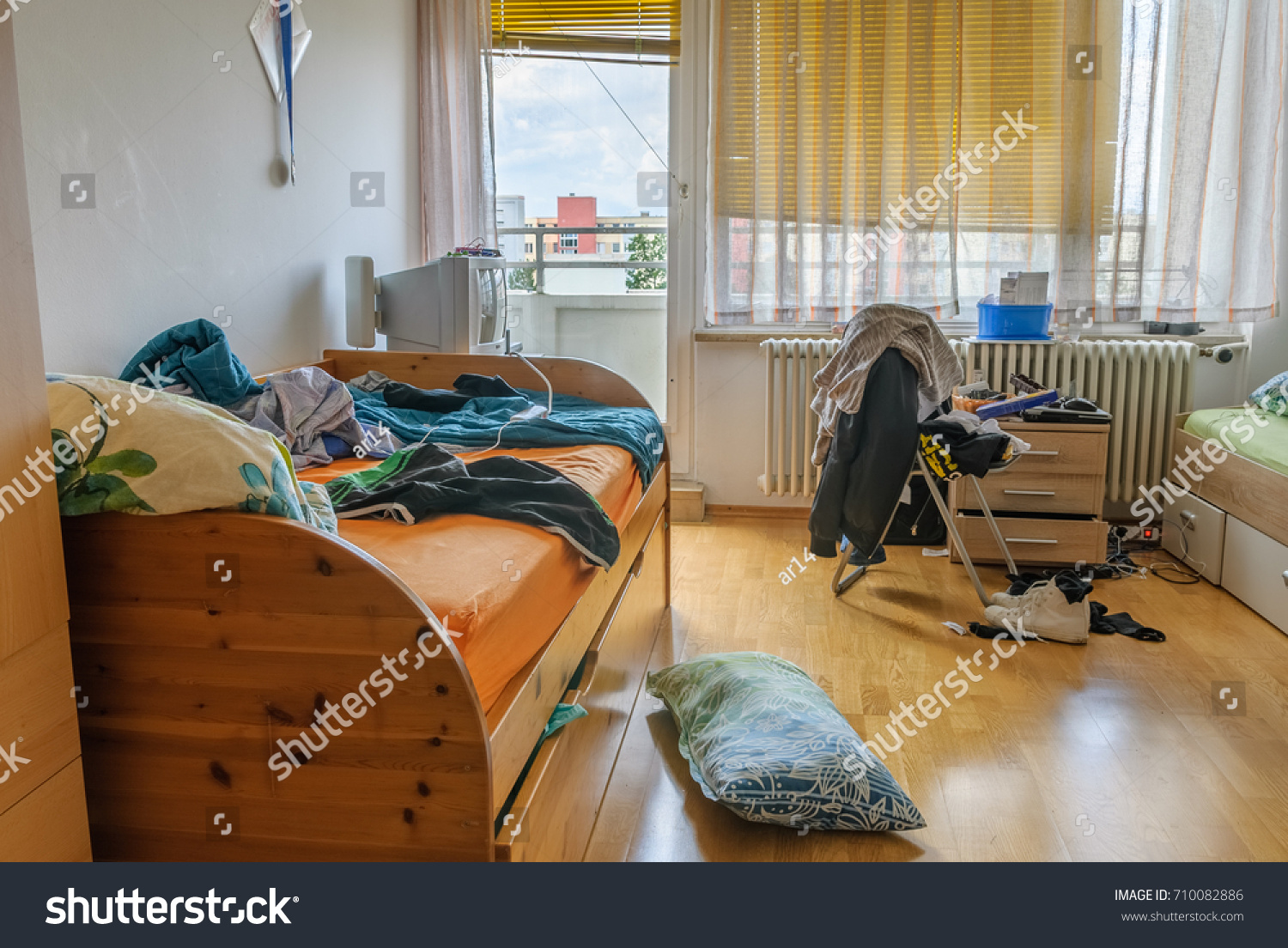 Messy bedroom, natural light #710082886