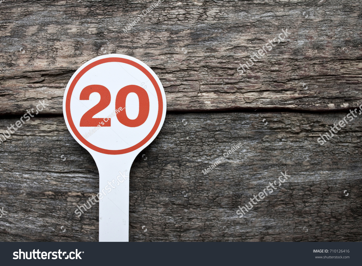 Plate number on a old wooden background. Numbers for lists or numbering concept.  #710126416
