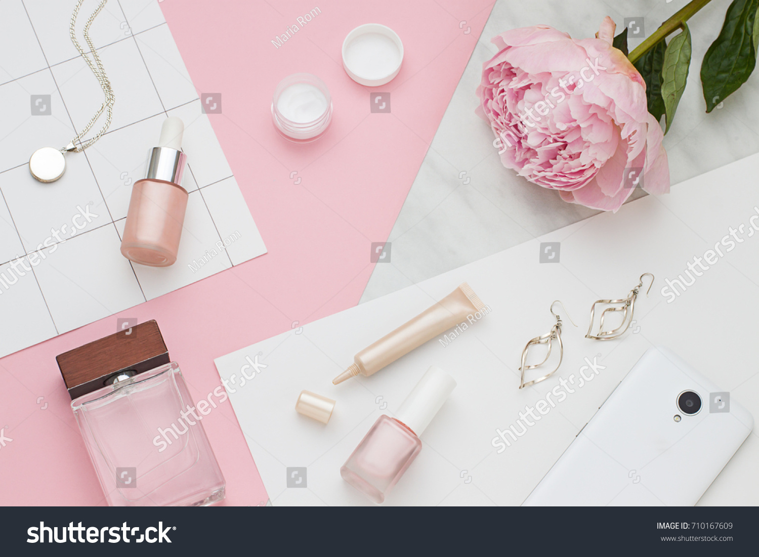 Beauty flat lay with cosmetic bottles, phone and flower. Top view
 #710167609