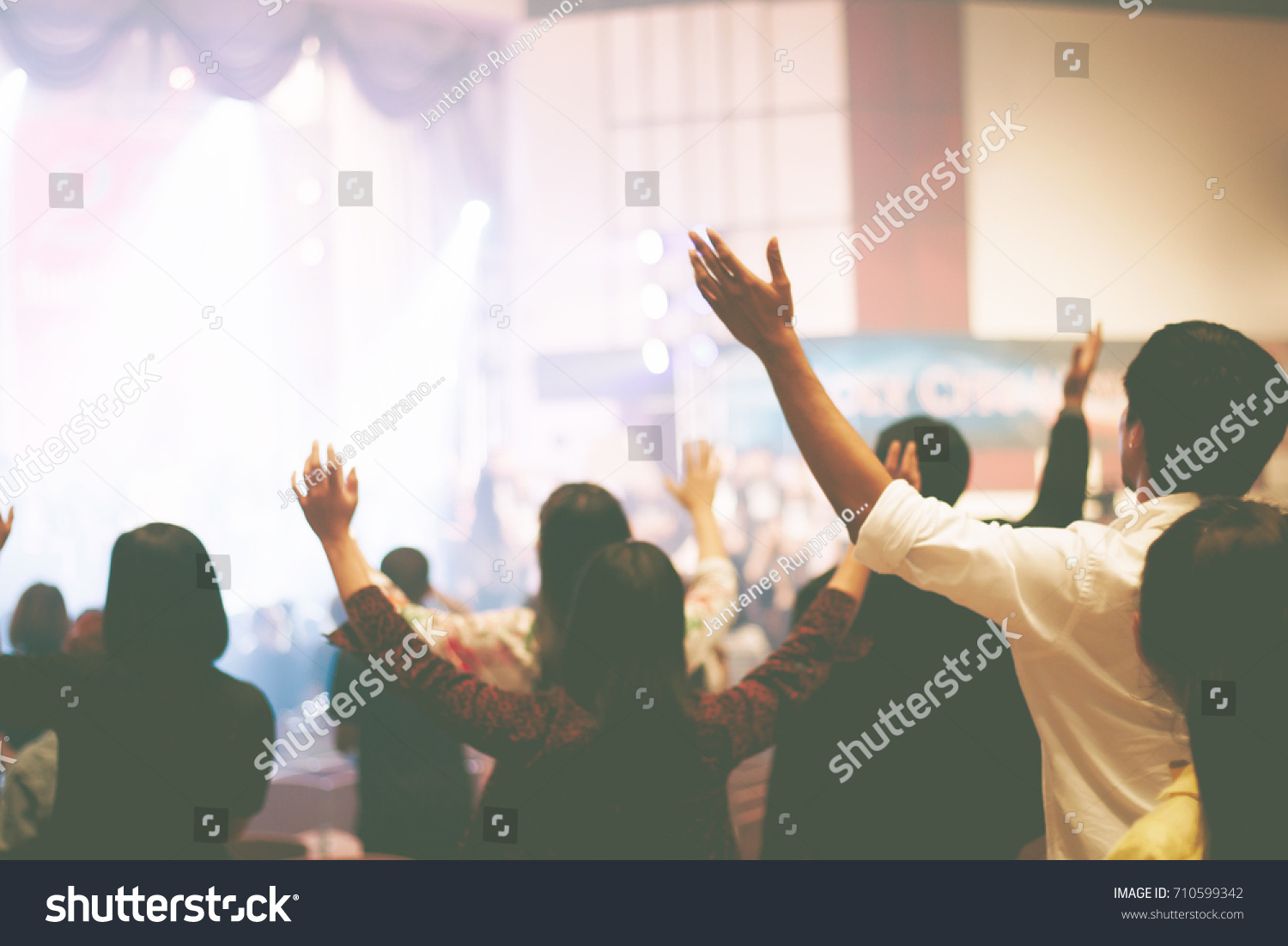 Christian worship with raised hand,music concert #710599342