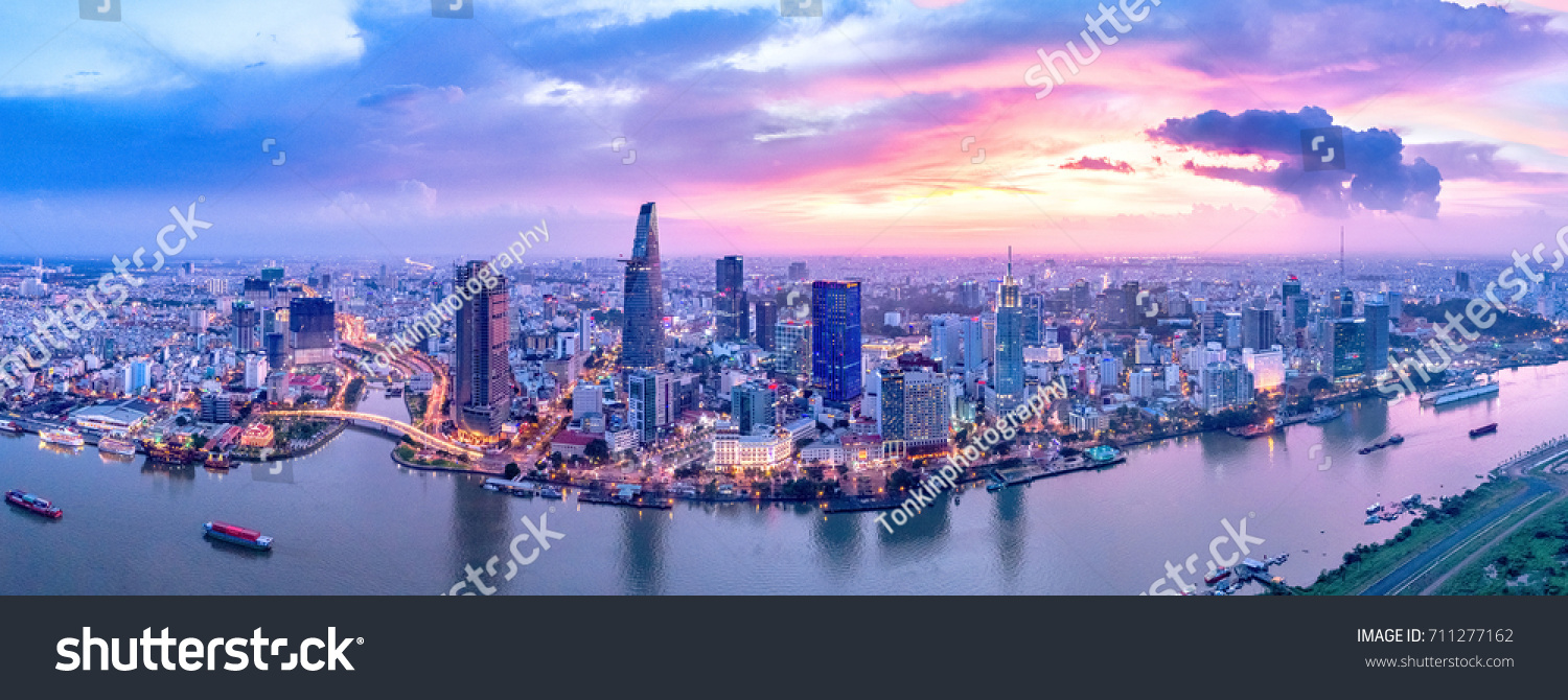 Royalty high quality free stock image aerial view of Ho Chi Minh city, Vietnam. Beauty skyscrapers along river light smooth down urban development in Ho Chi Minh City, Vietnam.  #711277162