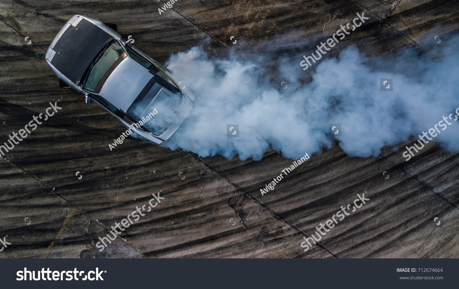 Drifting car, Aerial top view professional driver drifting car on race track, Abstract texture and background black tire tracks skid on asphalt road, Wheel tire tracks background, Car tire track. #712674664