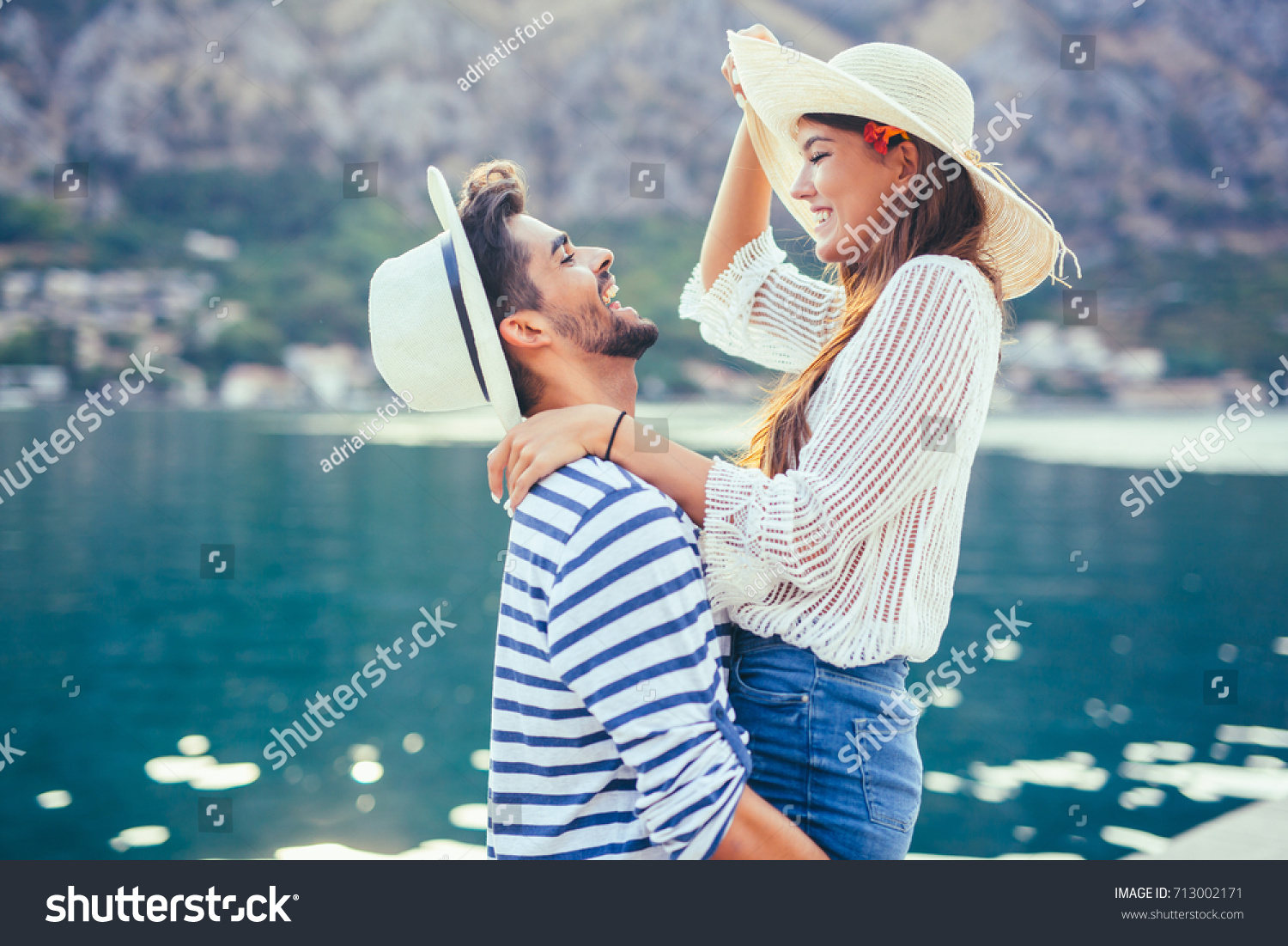 Couple in love, enjoying the summer time by the sea. #713002171