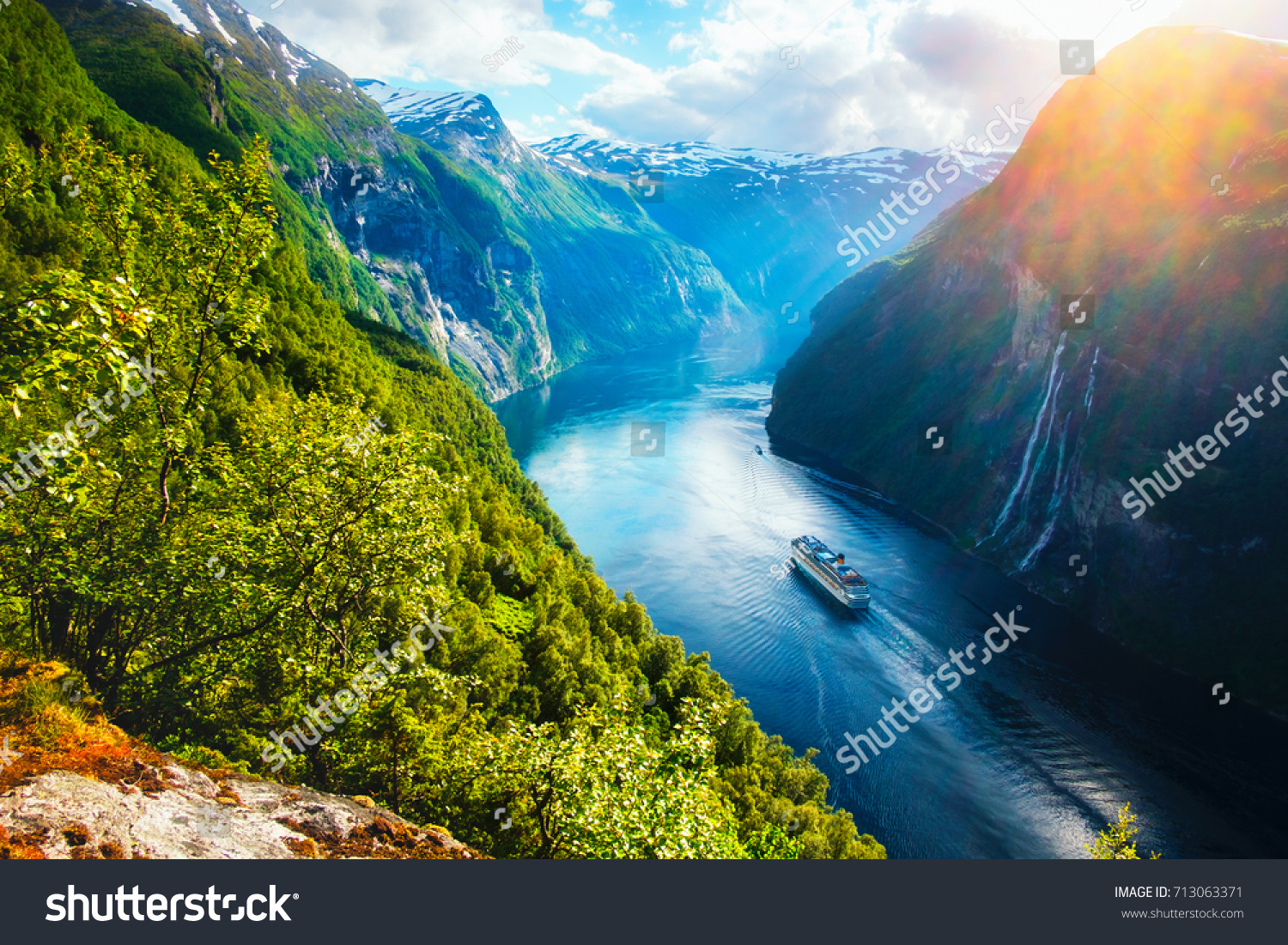 Breathtaking norway view of Sunnylvsfjorden fjord with cruise ship and famous Seven Sisters waterfalls, near Geiranger village in western Norway. Landscape photography #713063371