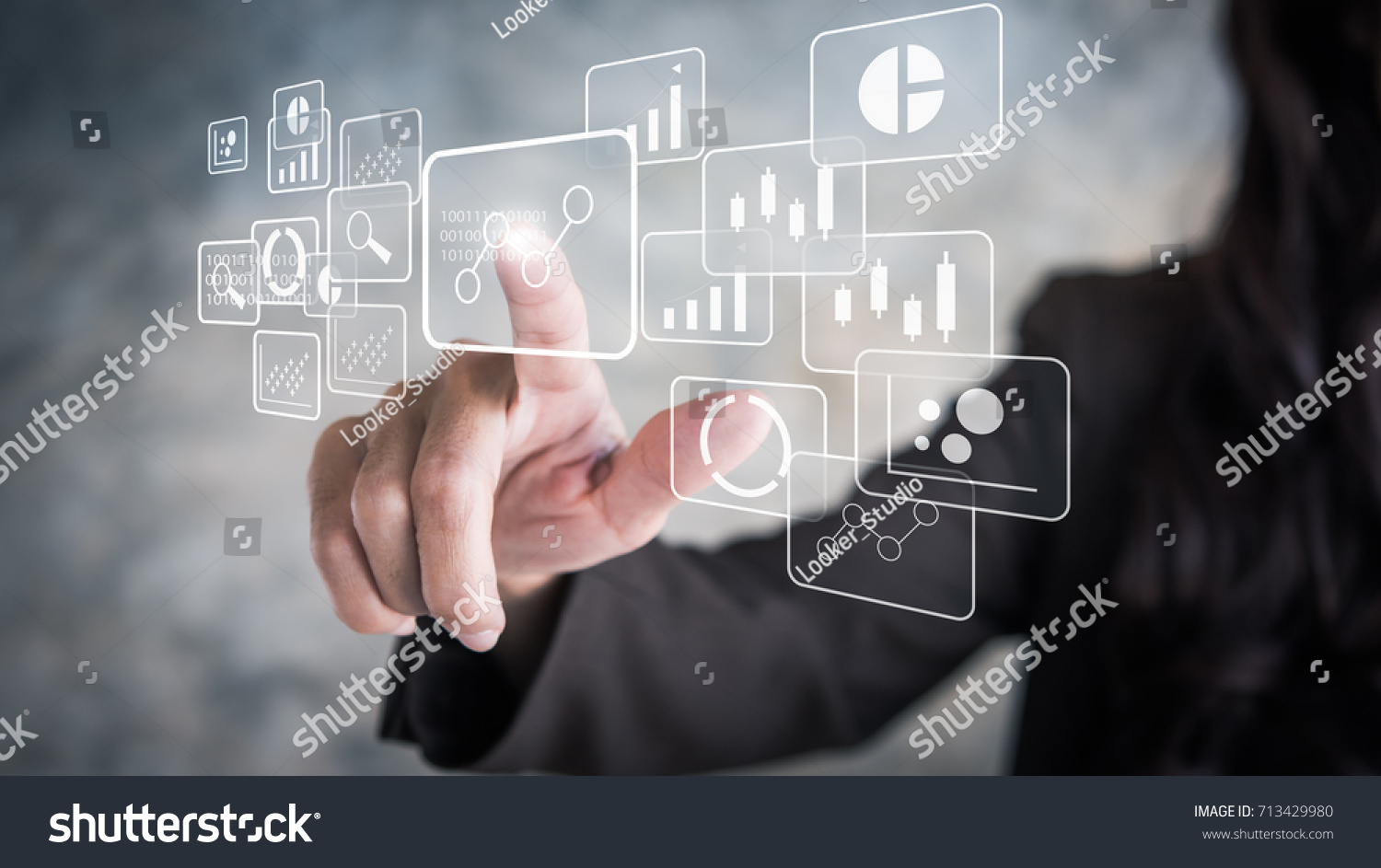 Big data analytics and business intelligence concept with chart and graph icons on a digital screen interface and a businessman in background #713429980