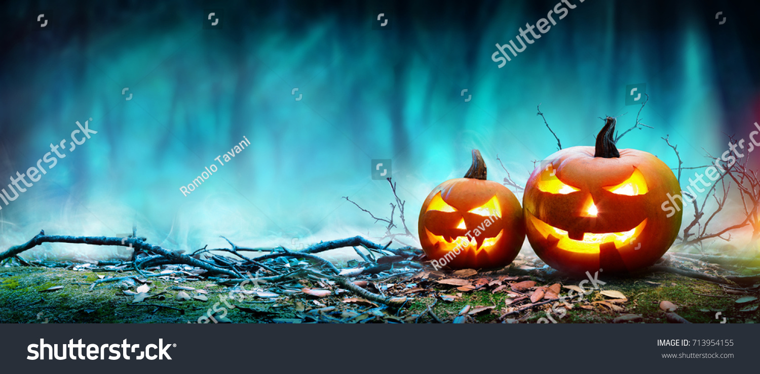 Jack O’ Lanterns Glowing At Moonlight In The Spooky Night - Halloween Scene
 #713954155