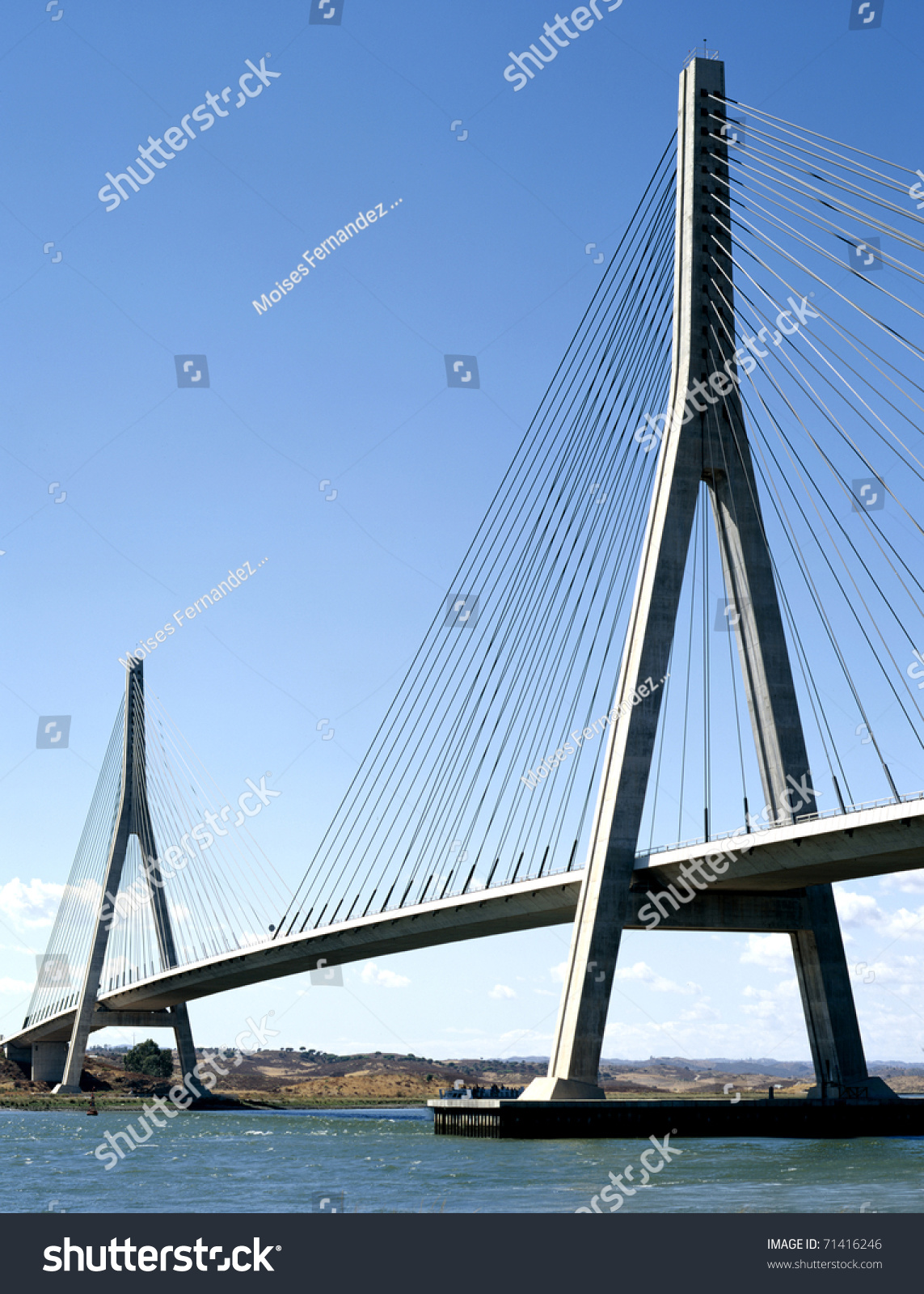 Suspension bridge over the river between Spain and Portugal #71416246