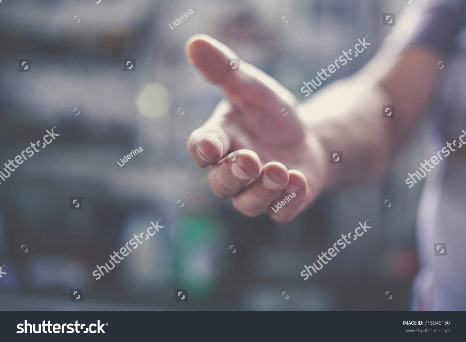 Senior worker provides hand. Close up. #715045180