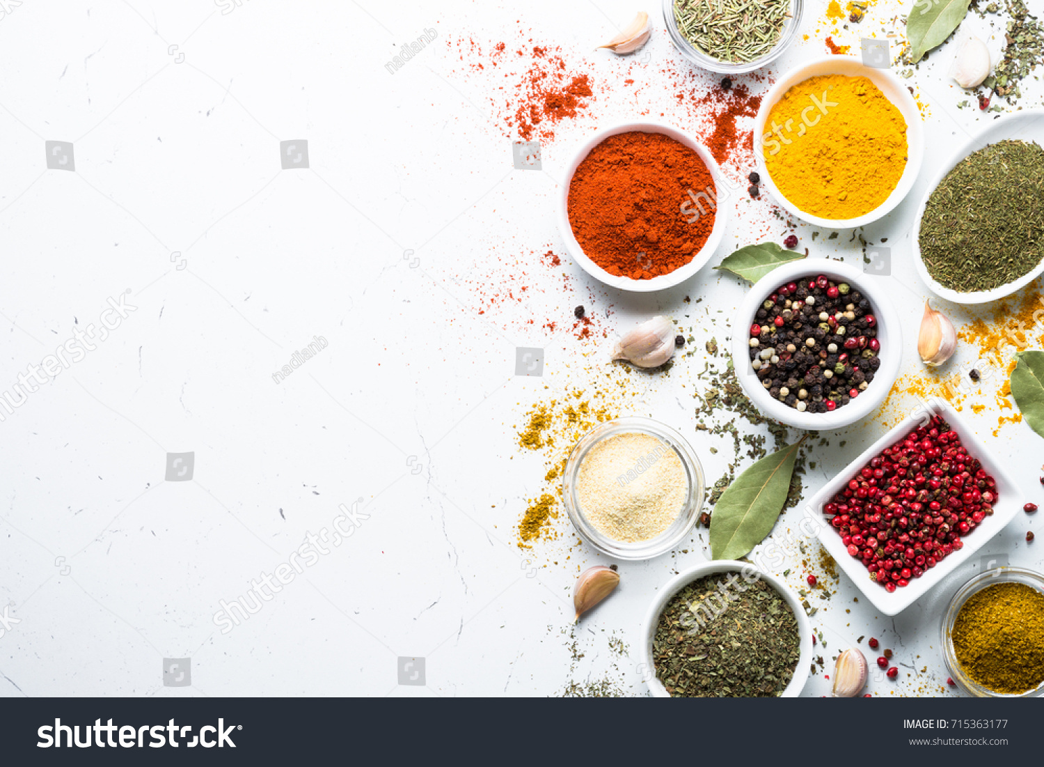 Set of various spices in a bowls on white background. Top view copy space. #715363177