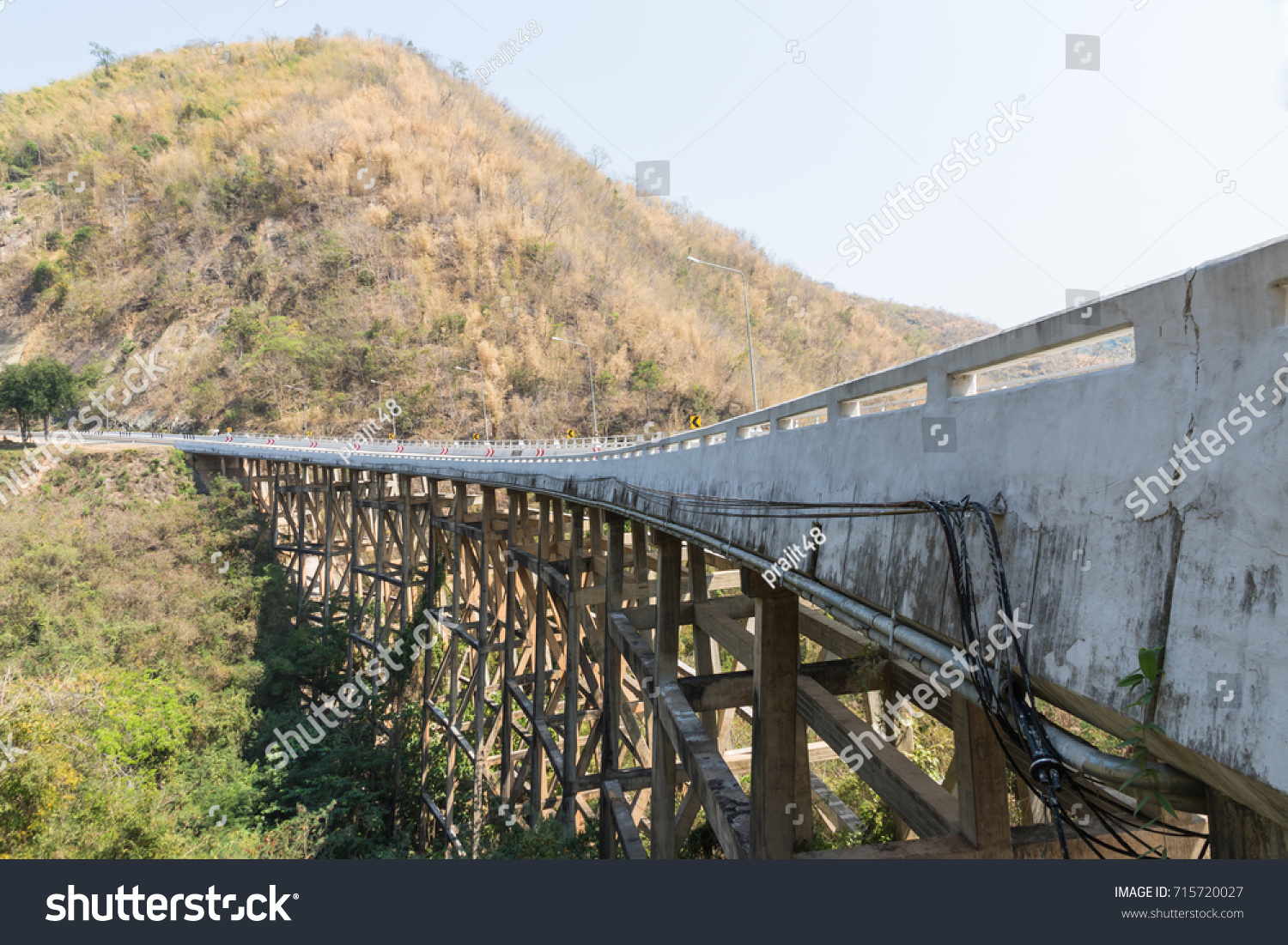 Concrete bridge across the deep gorge in the valley, Thailand #715720027