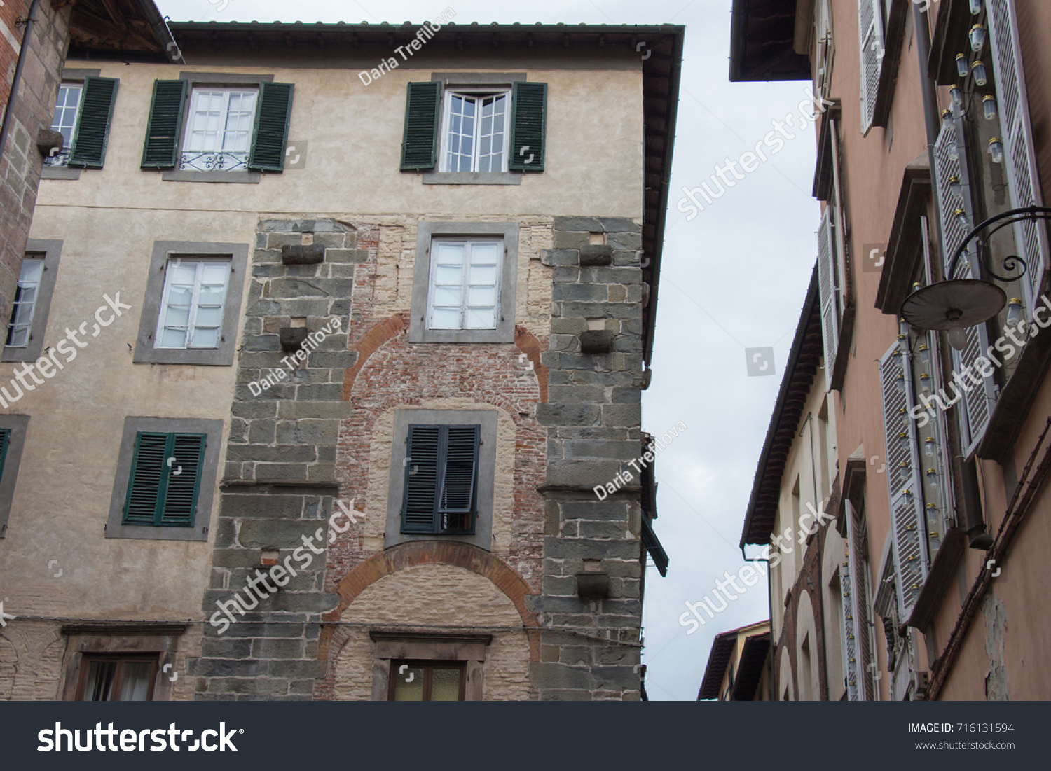 Italy, Lucca - September 18 2016: the detailed view of old building in Lucca   #716131594