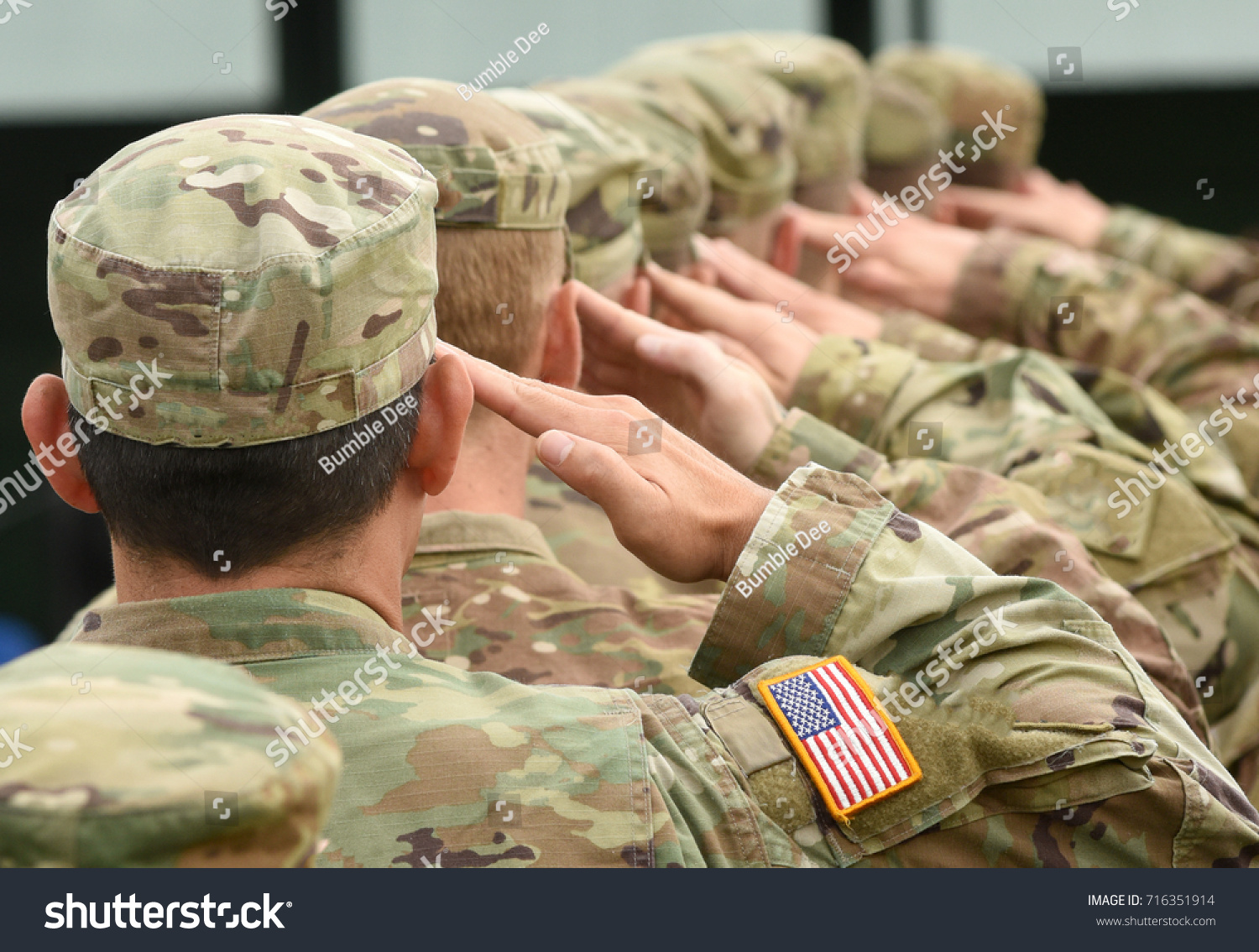 US soldiers giving salute  #716351914