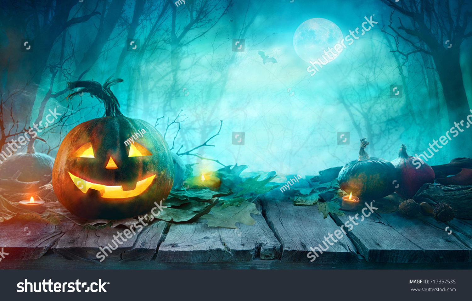 Halloween Pumpkins on wood. Halloween Background At Night Forest with Moon.
 #717357535