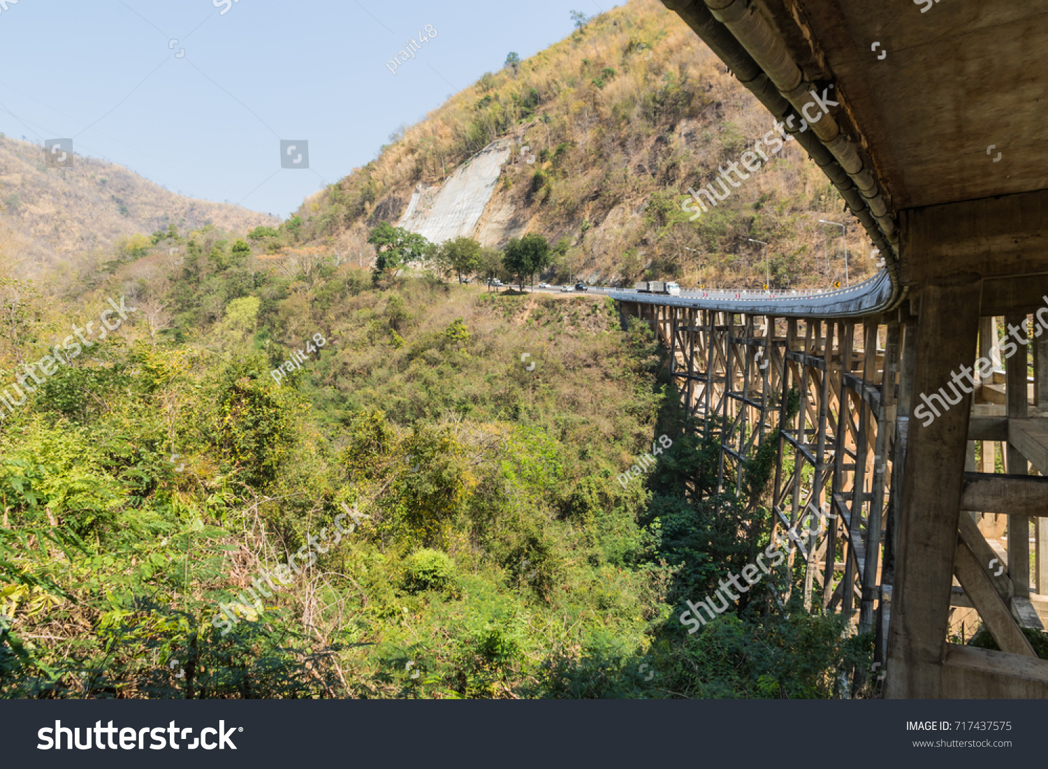 Concrete bridge across the deep gorge in the valley, Thailand #717437575