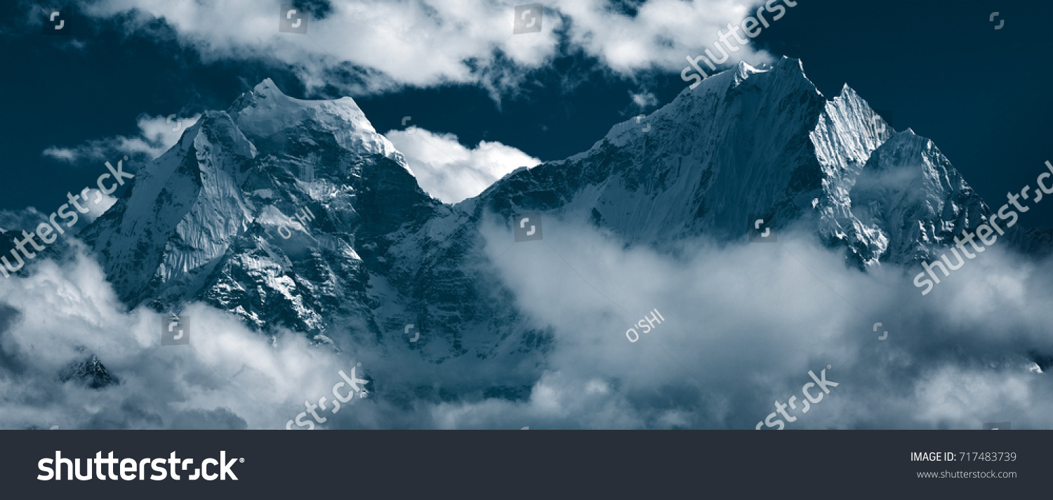 Panoramic view of mountain peaks Kangtega, also known as "The Snow Saddle" (6,782 m.) and Thamserku (6,608 m.). Himalayas, Khumbu, Eastern Nepal #717483739